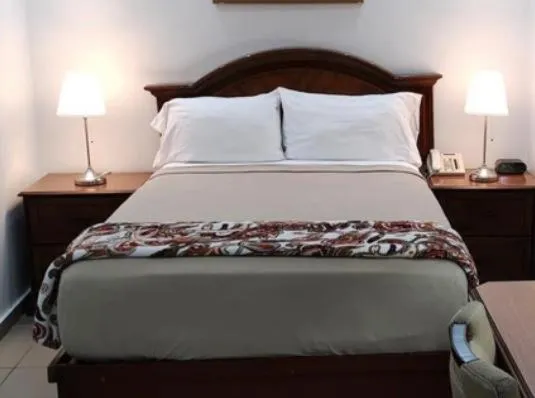 Bed in Micro Hotel Condo Suites