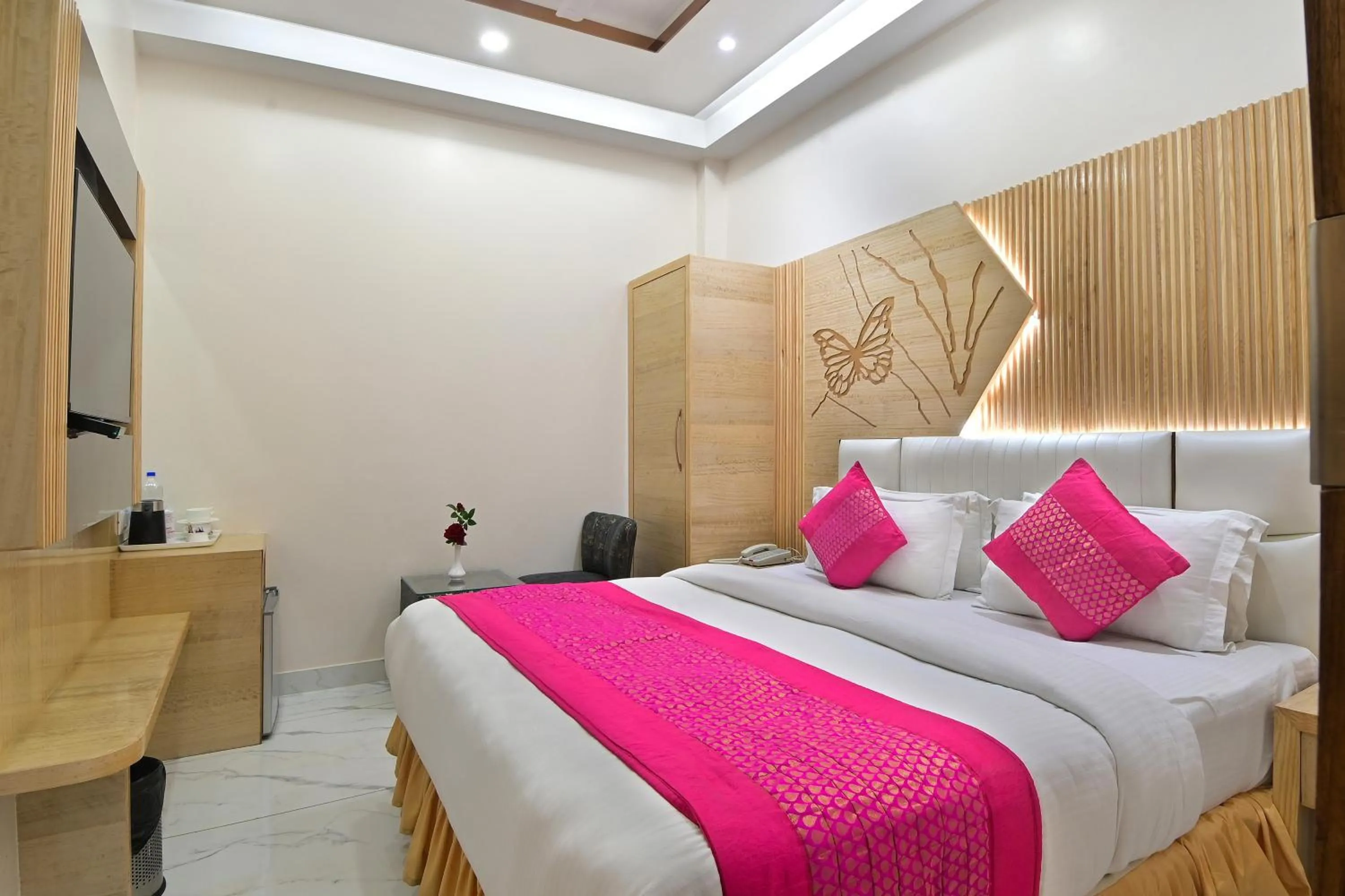 wardrobe, Bed in Hotel Aman International -All Staff Vaccinated