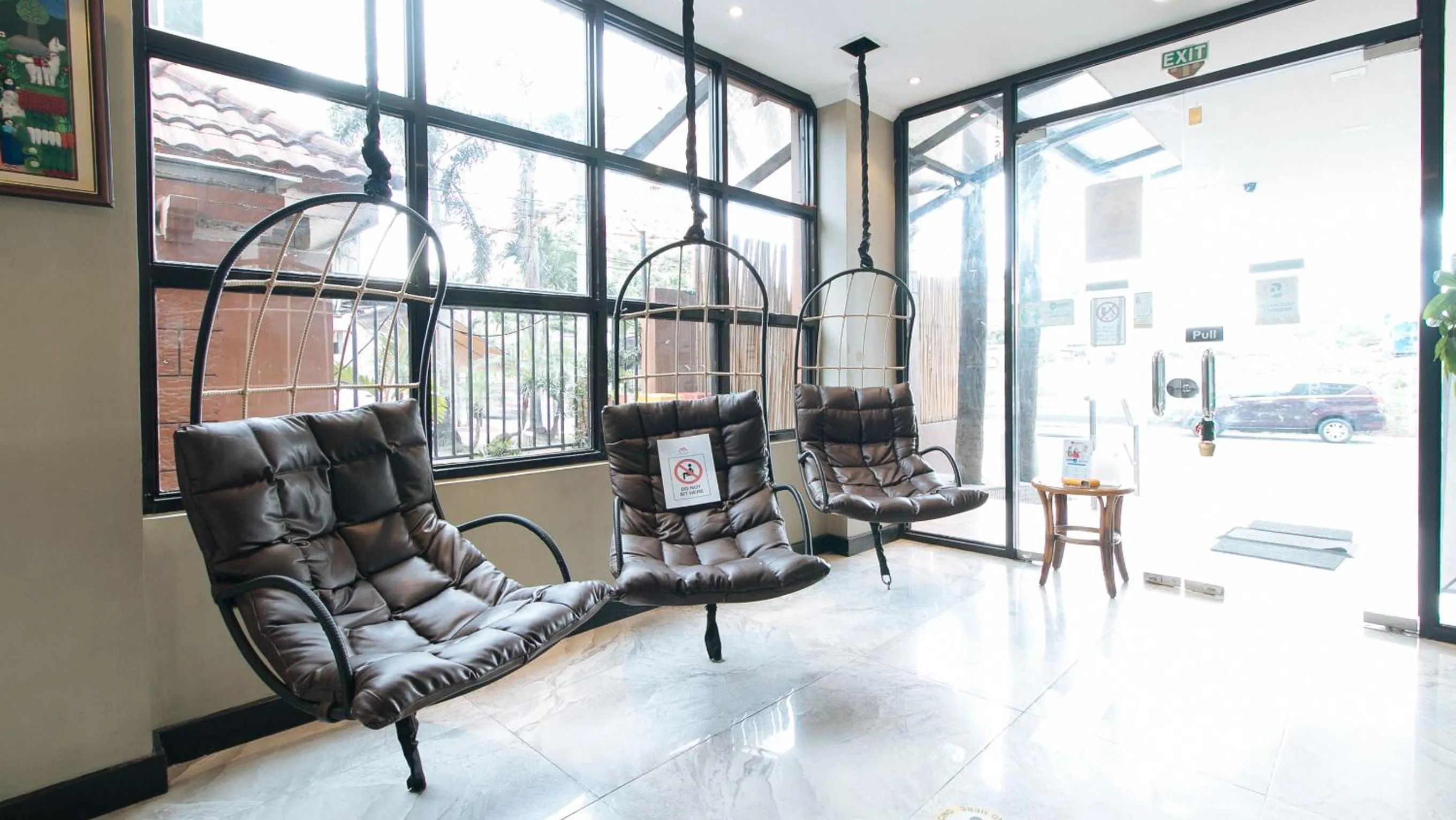 Seating area in RedDoorz Plus at MM Hotel Las Pinas former RedDoorz Plus Near Bamboo Organ