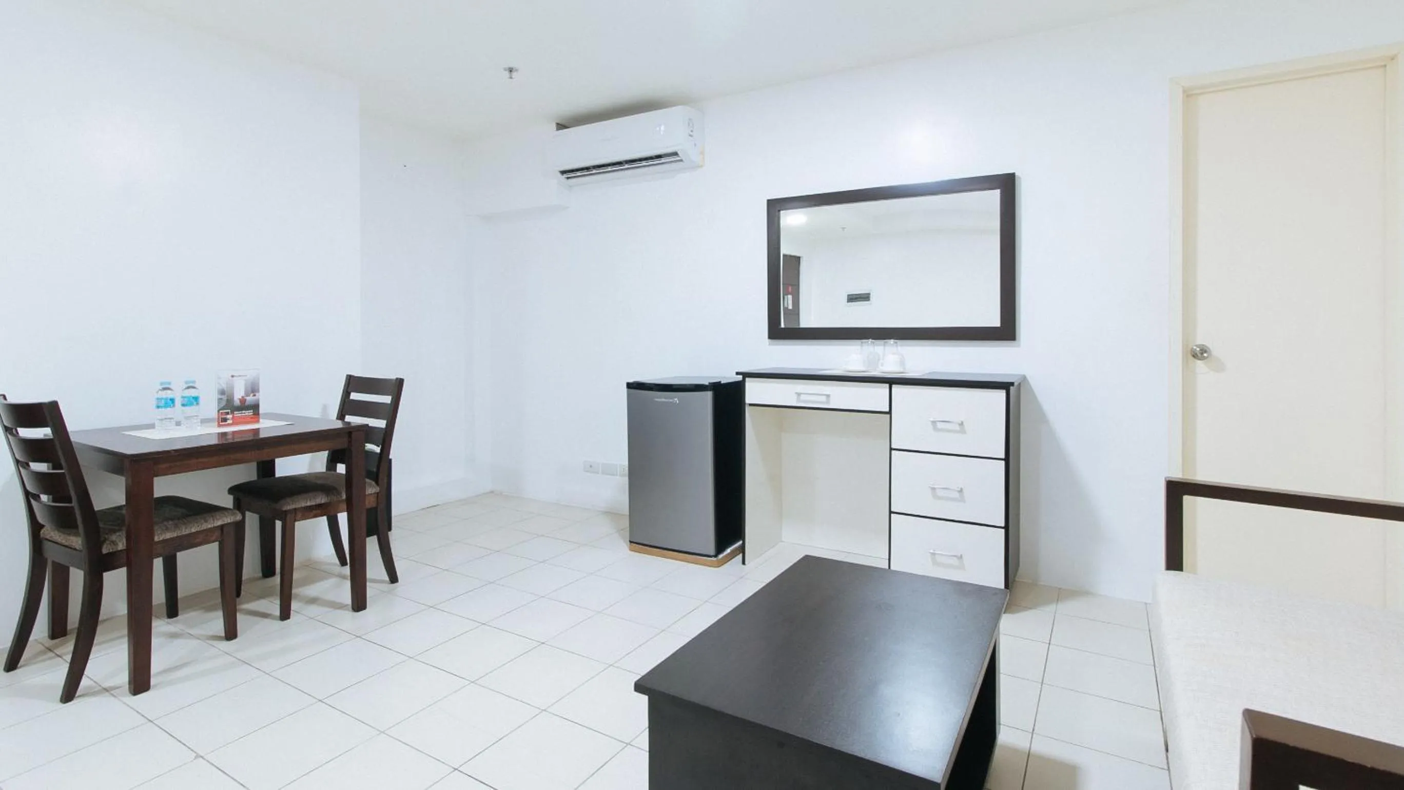 Seating area in RedDoorz Plus at Evangelista Street Makati