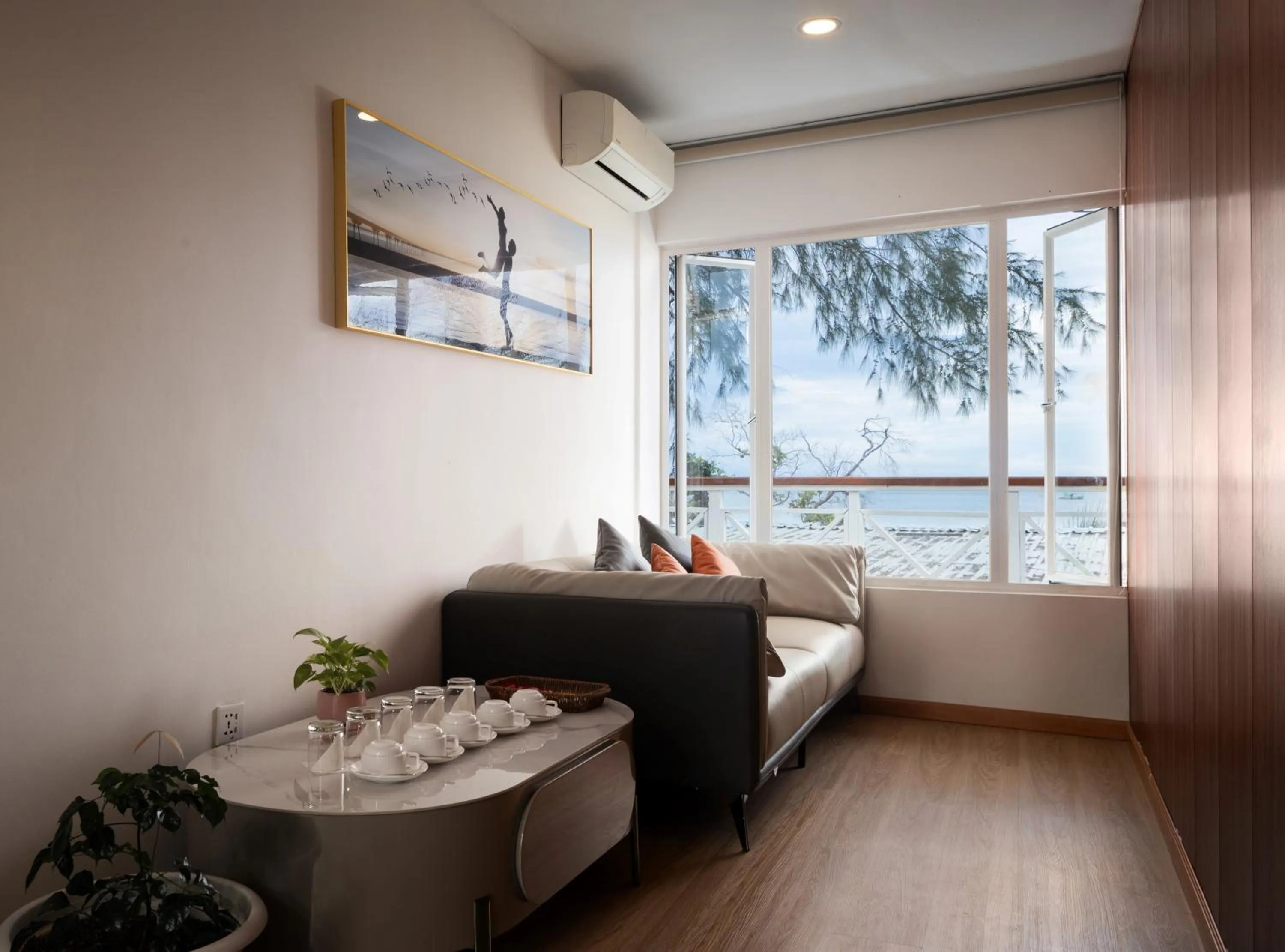 Living room, Bed in One Beach Resort by EHM