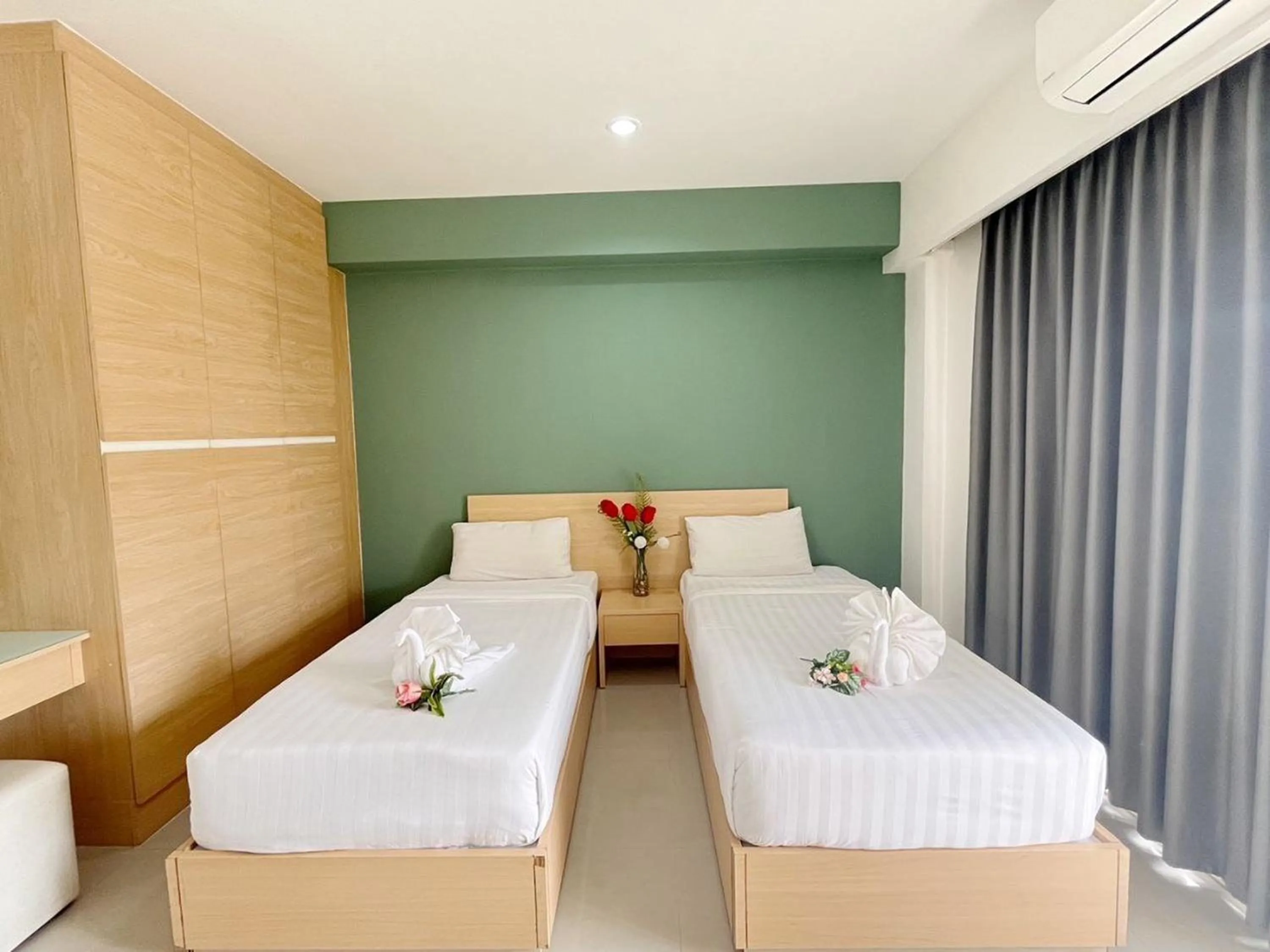 Bed in Ruan Plaisoi Apartment