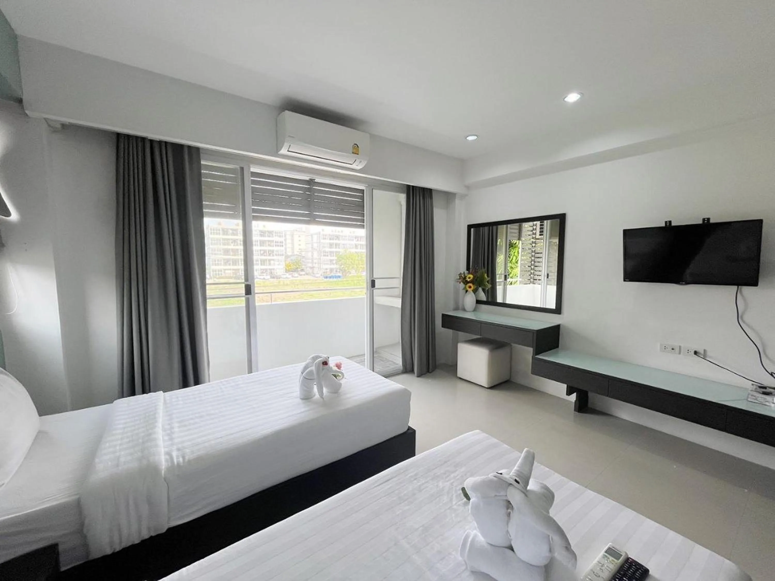 Bed in Ruan Plaisoi Apartment