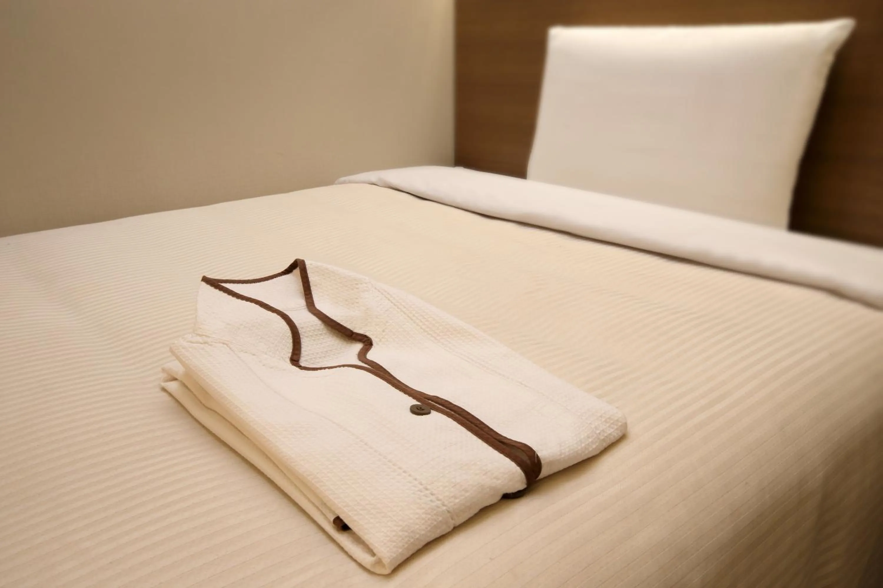 Bed in Keio Presso Inn Nihonbashi Kayabacho