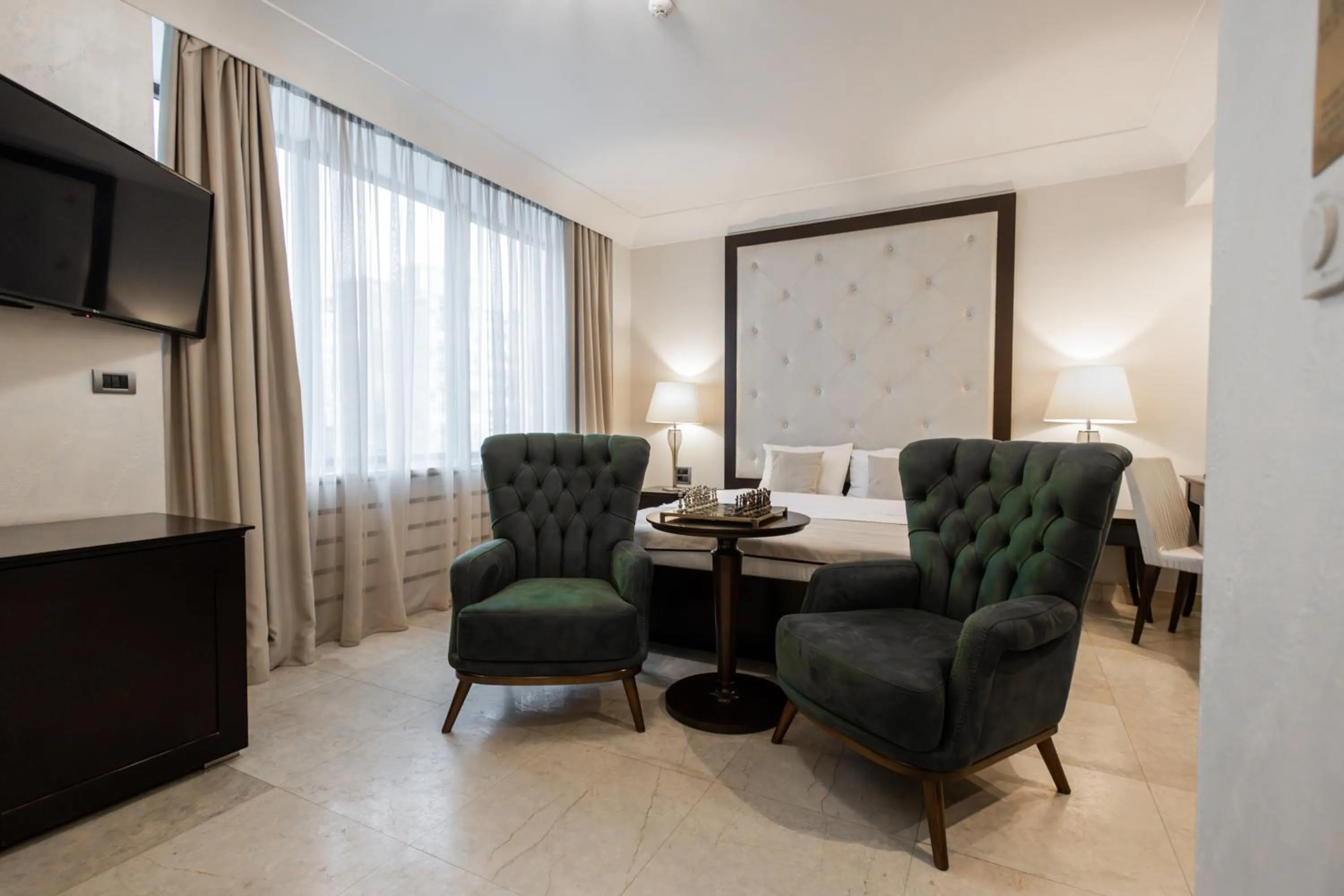 Seating area, Bed in GARNI HOTEL AMI