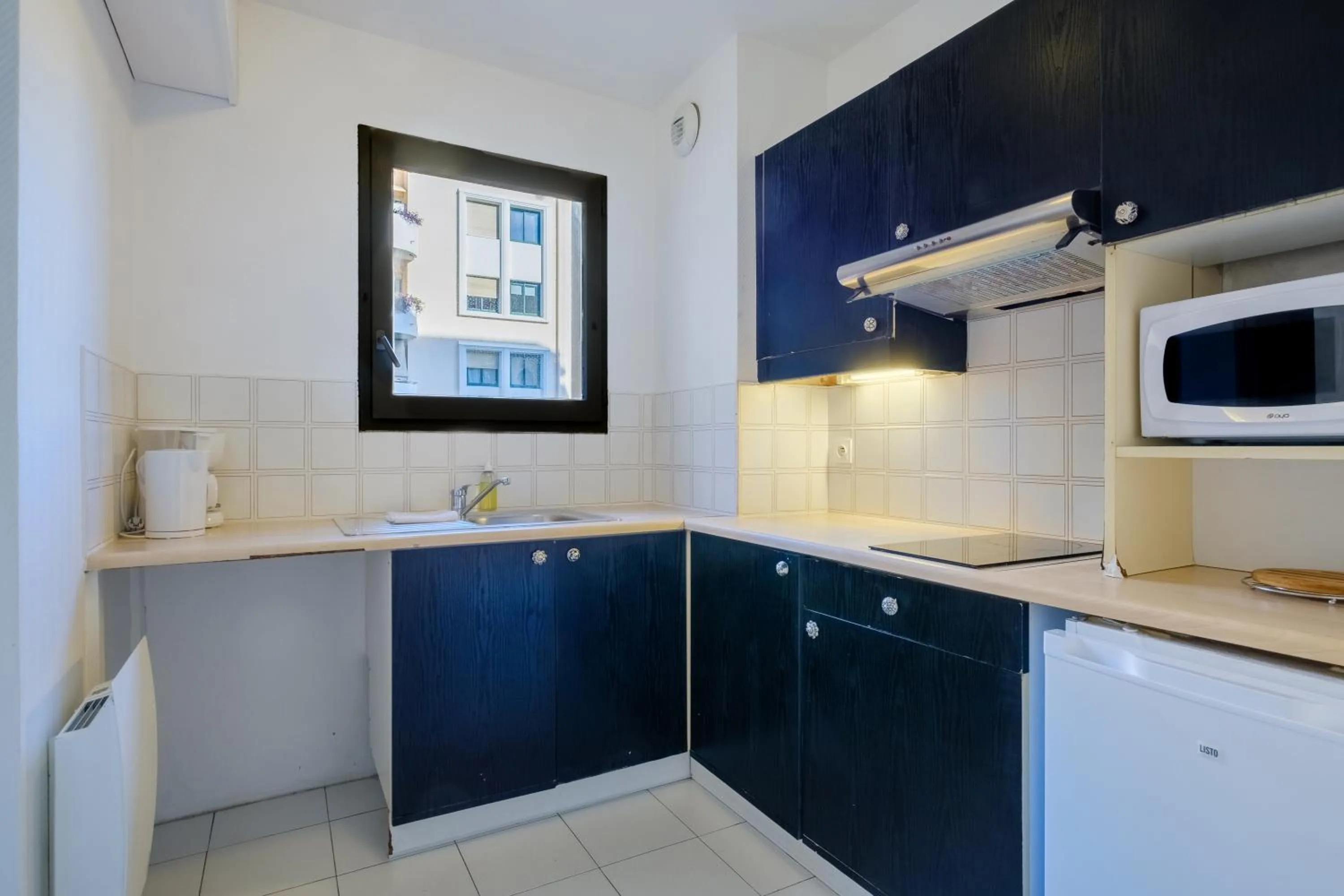 Kitchen or kitchenette in Residhotel Villa Maupassant