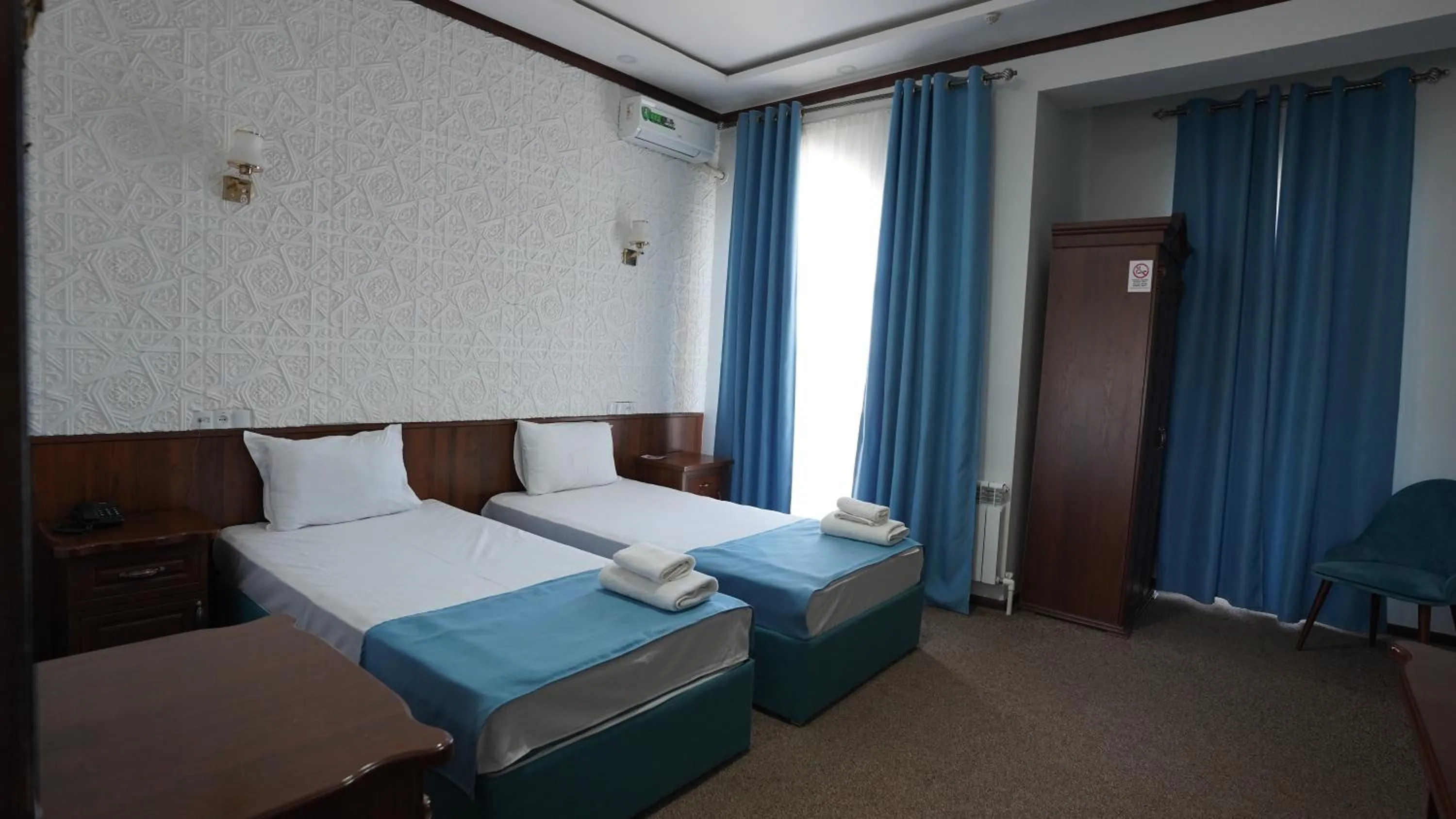 Bed in Hotel Khiva Palace