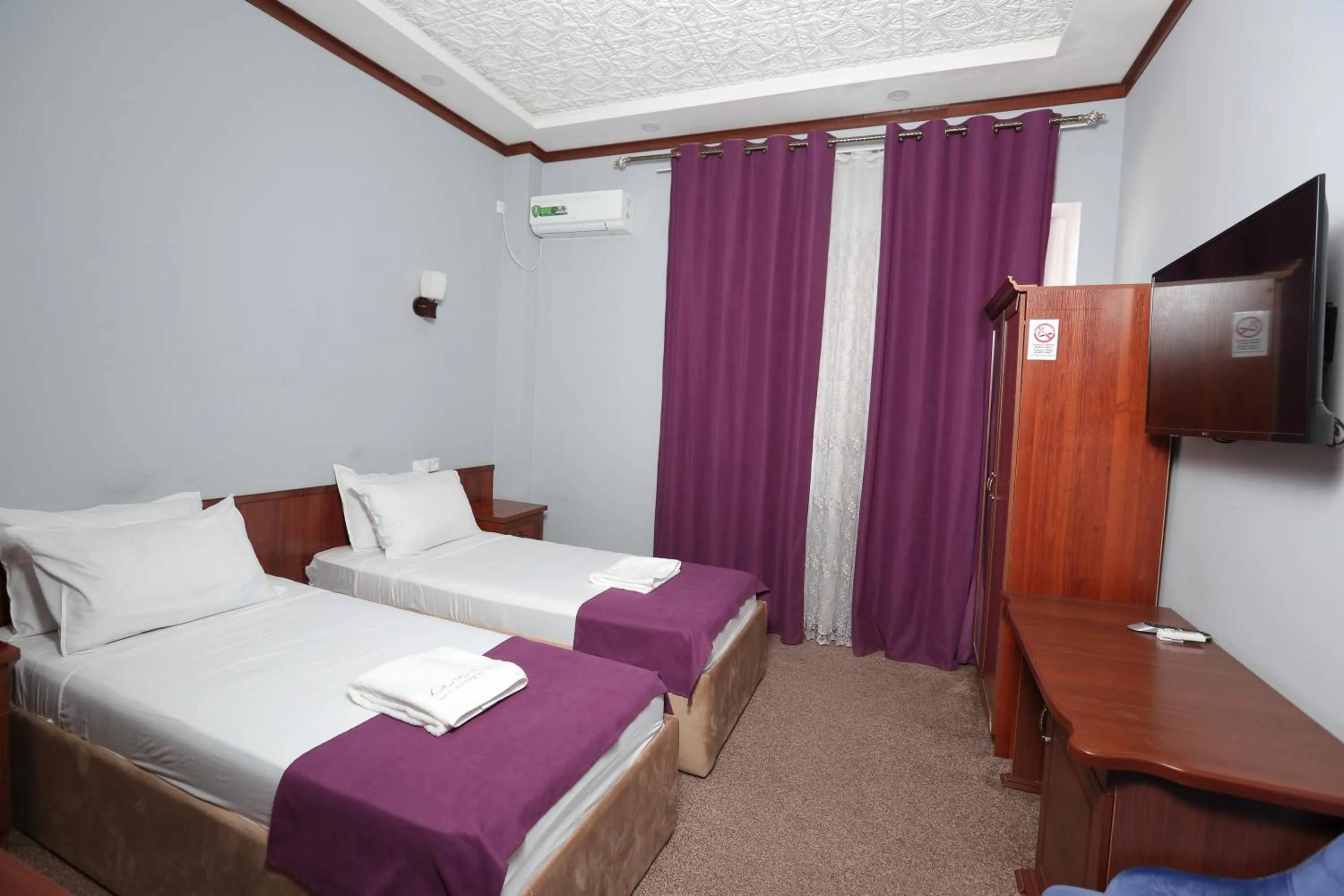 Bed in Hotel Khiva Palace