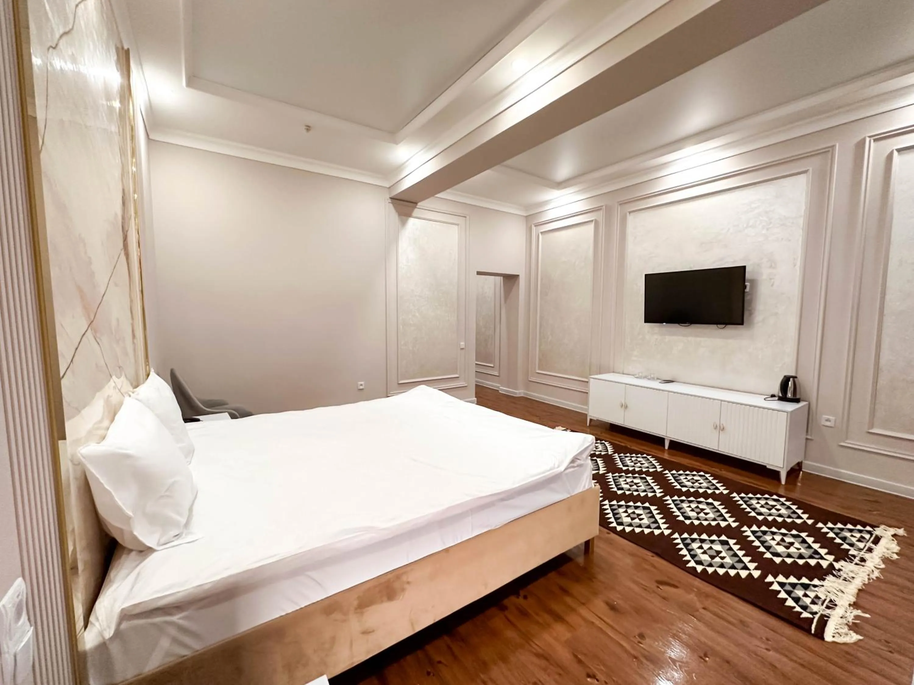 Bed in Hotel Khiva Palace