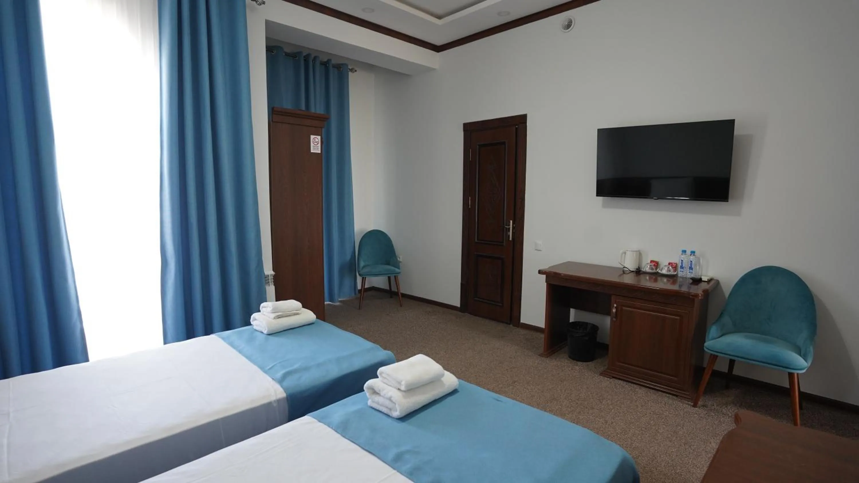 Bed in Hotel Khiva Palace