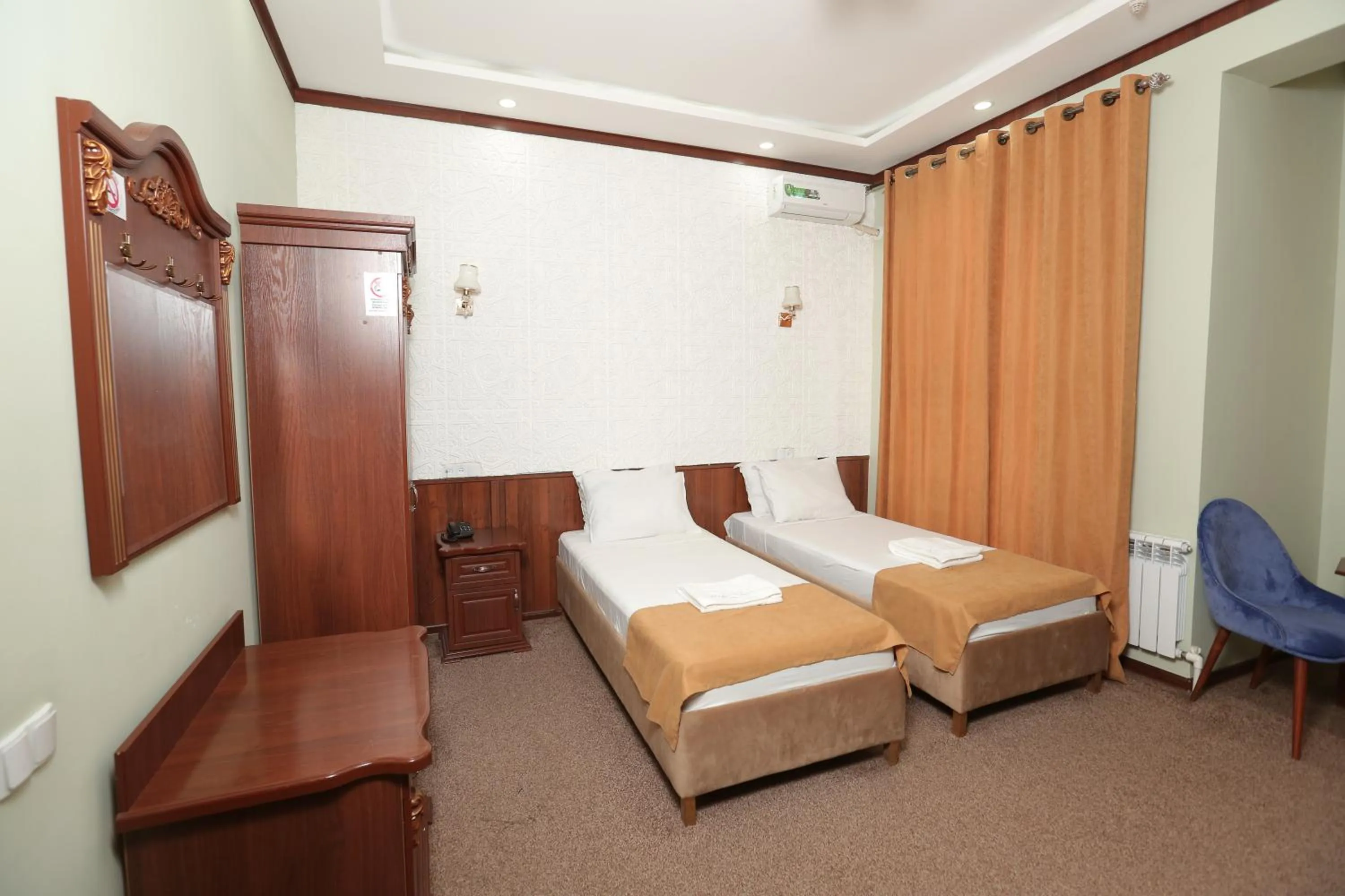 Bed in Hotel Khiva Palace