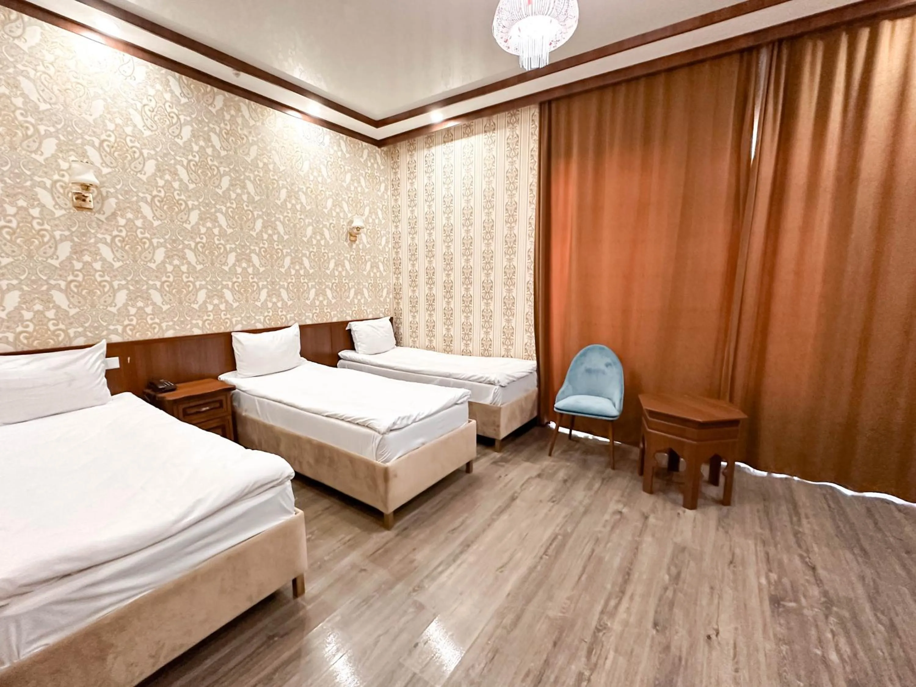 Bed in Hotel Khiva Palace