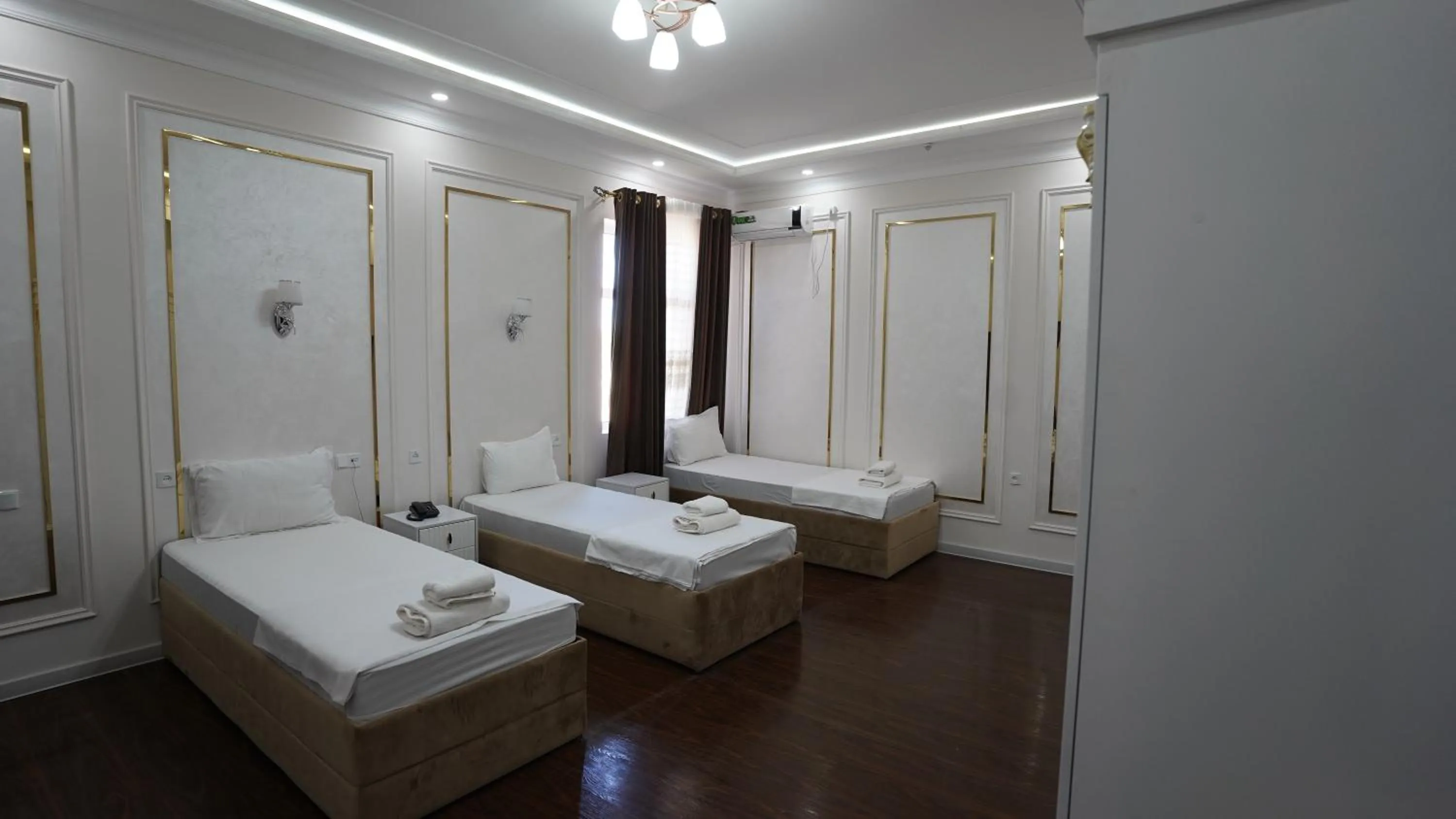 Bed in Hotel Khiva Palace