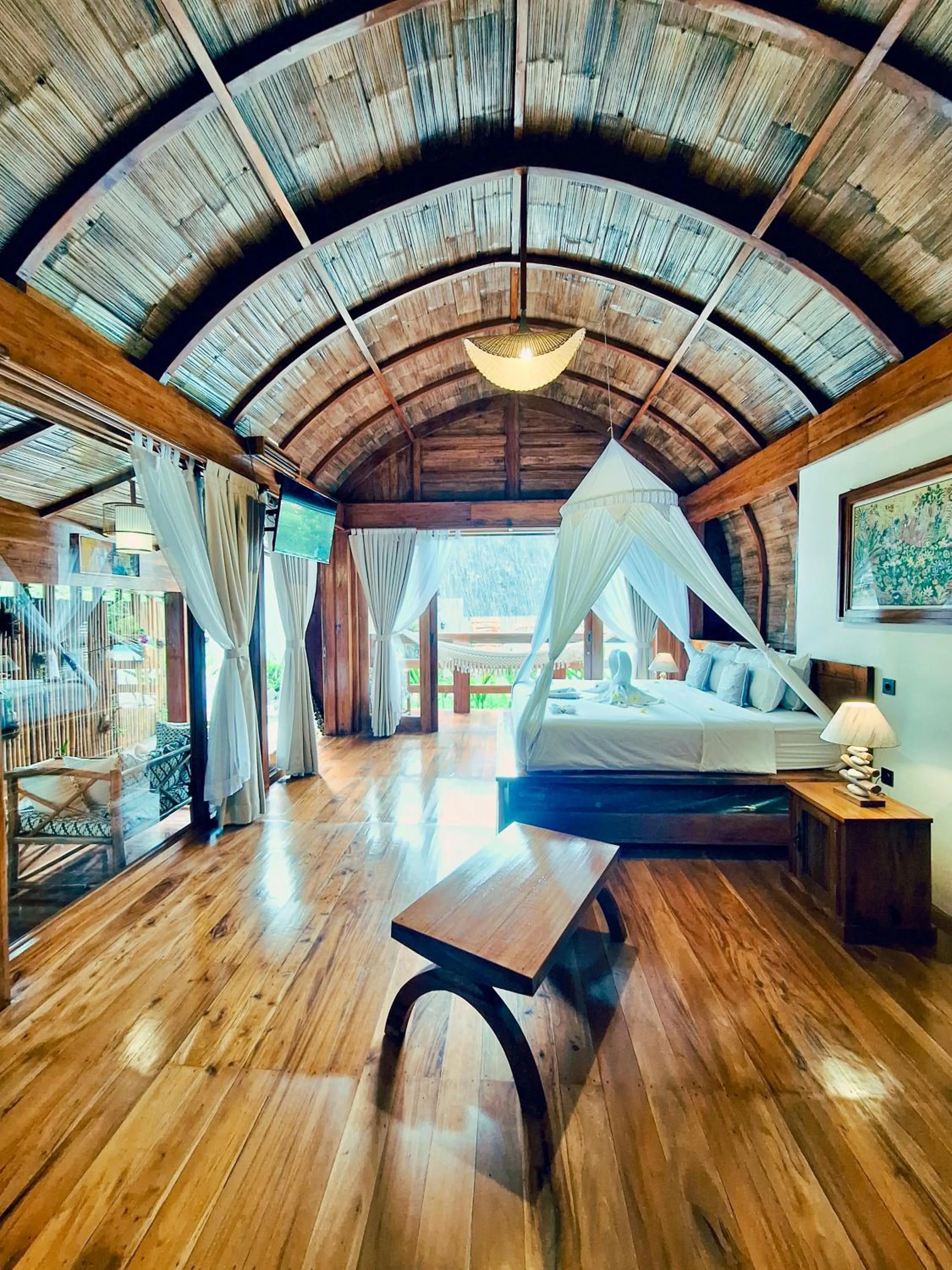 Photo of the whole room, Bed in Lagoona Beach Bungalows - Eco Bungalows Batukaras