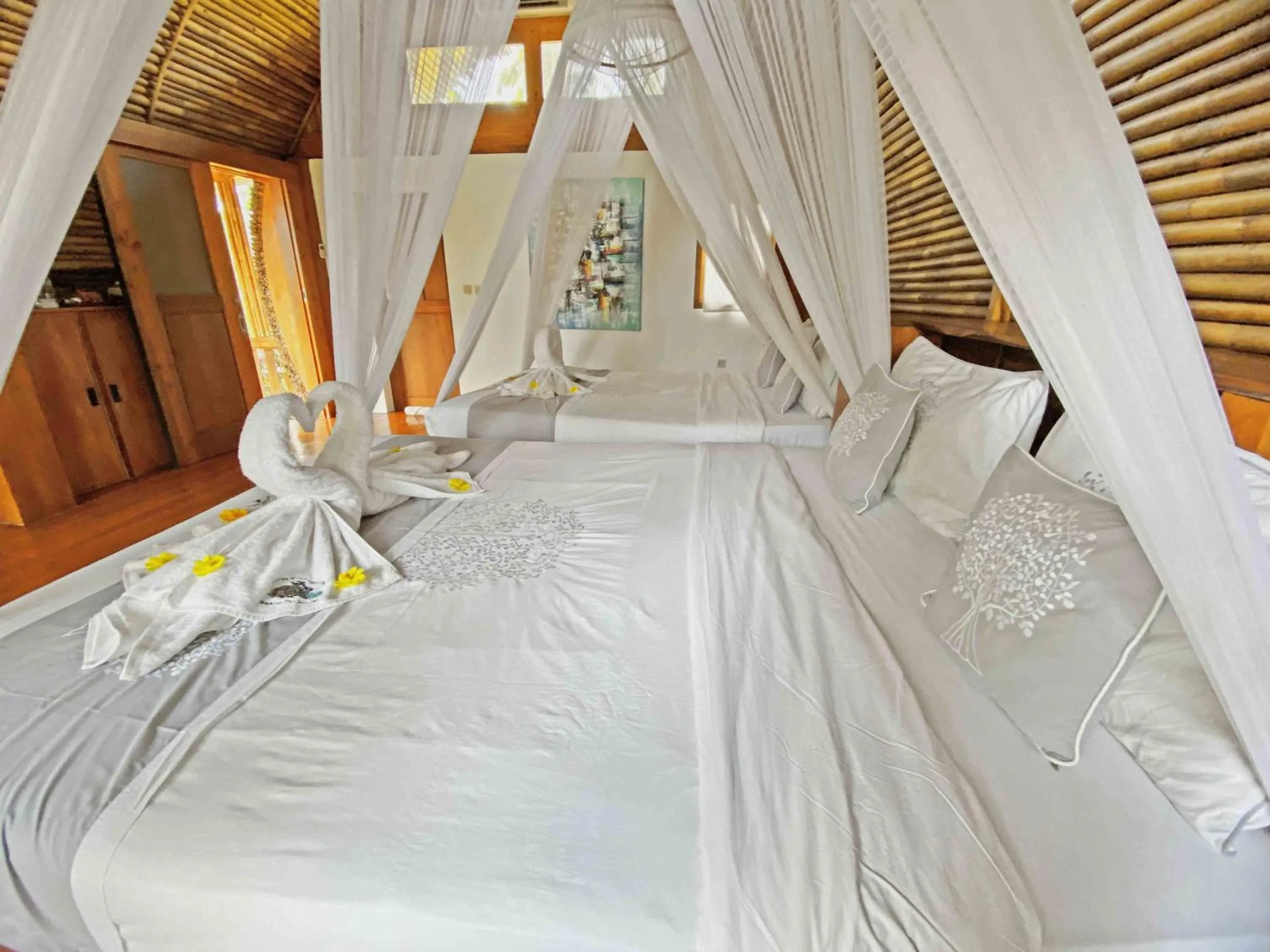 Bed in Lagoona Beach Bungalows - Eco Bungalows Batukaras