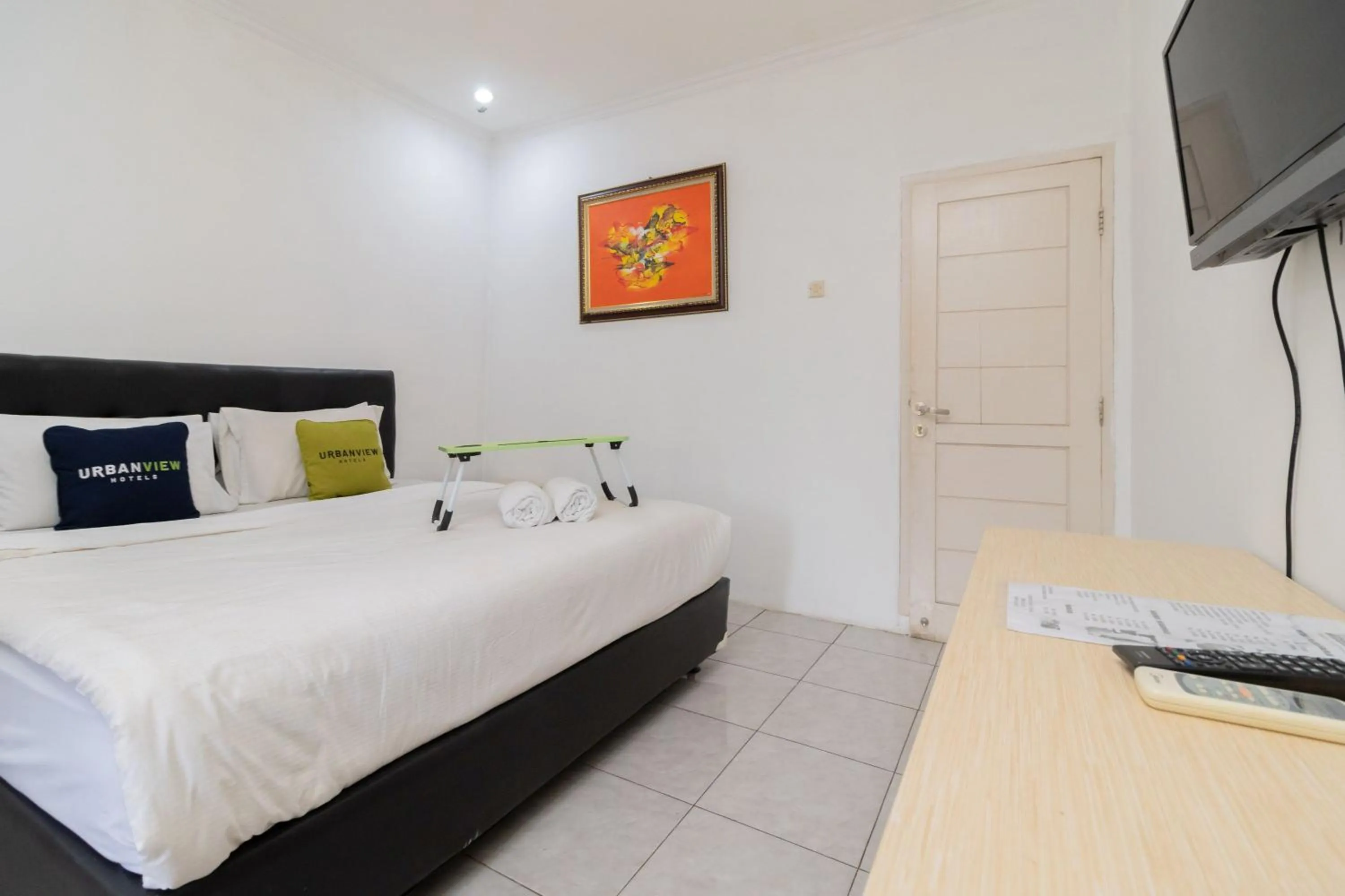 Bedroom, Bed in Urbanview Hotel Gunung Geulis Village by RedDoorz