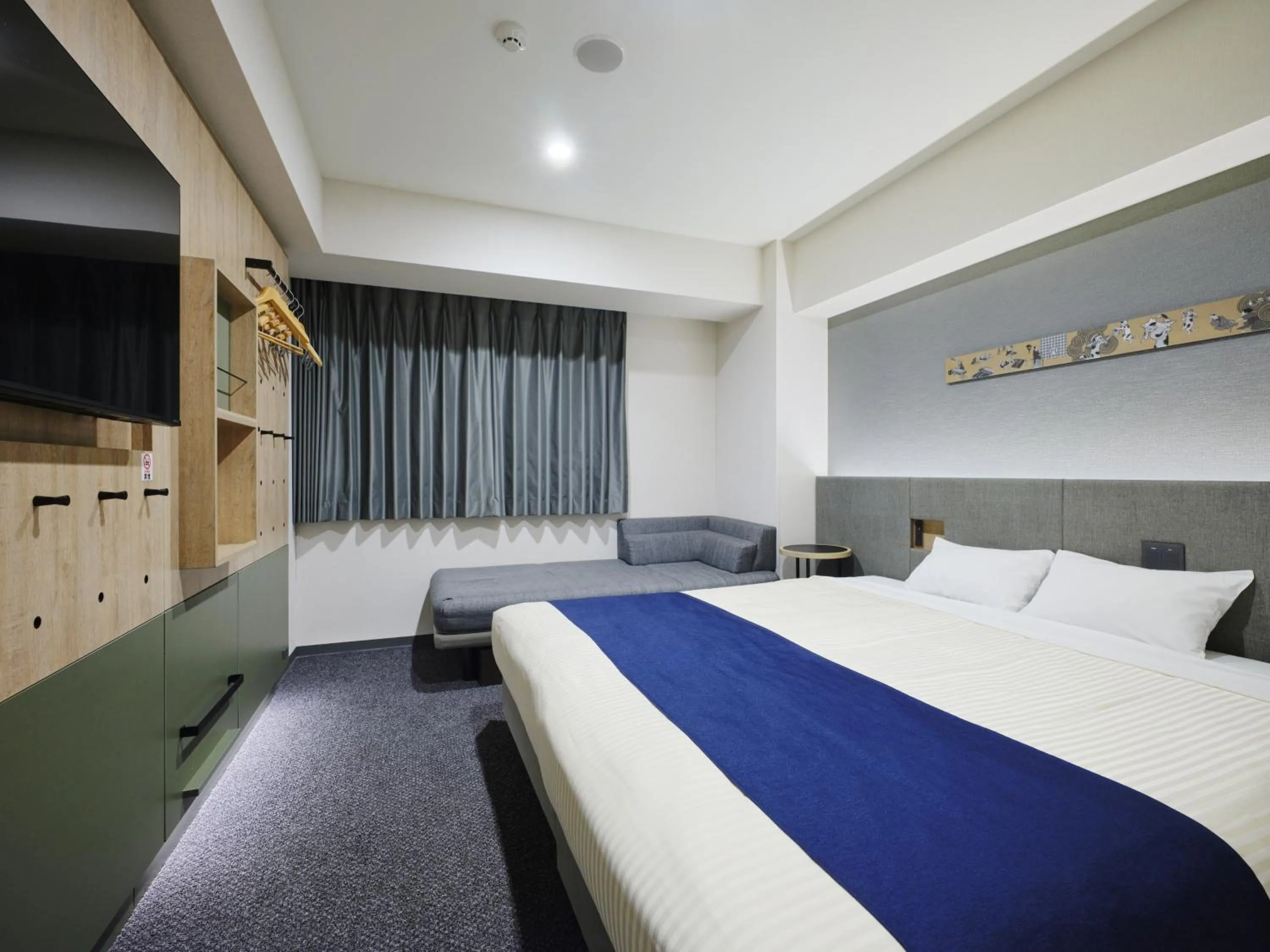 Bed in hotel MONday Premium Ueno Okachimachi