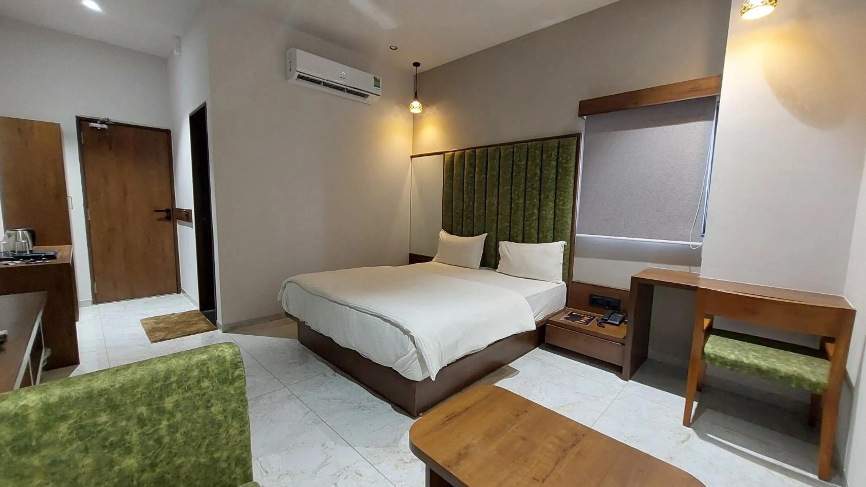 air conditioner, Bed in Hotel Sparsh Inn - Chandkheda