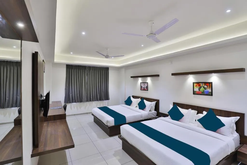 Photo of the whole room, Bed in Hotel Sparsh Inn - Chandkheda