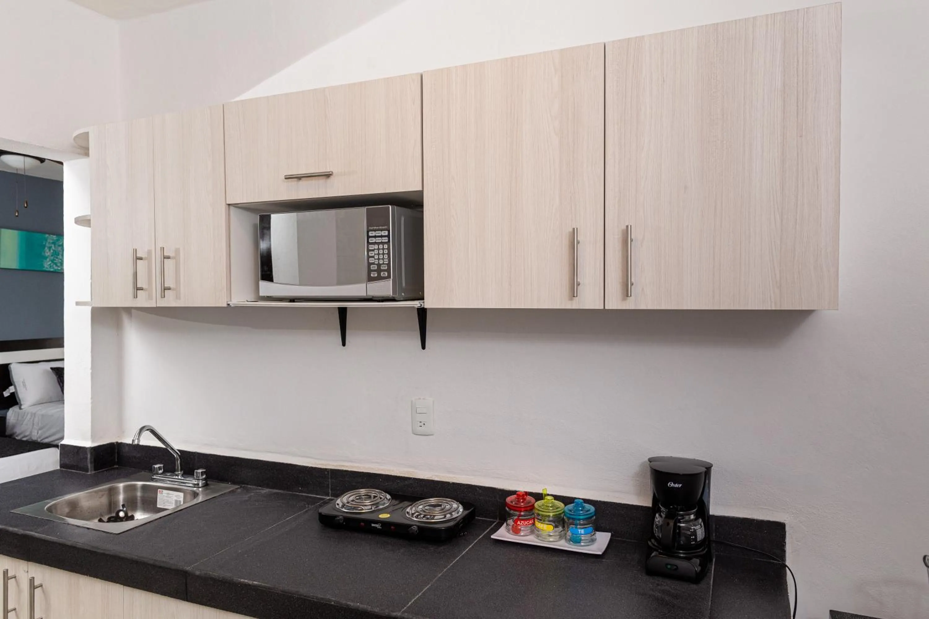 Kitchen or kitchenette in Santa Fe Studios And Suites