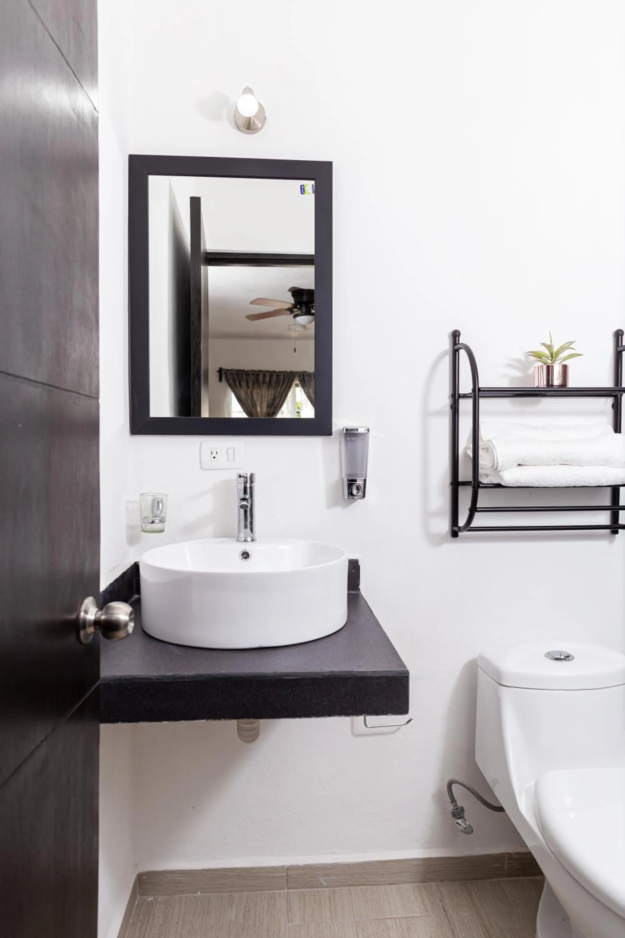 Bathroom in Santa Fe Studios And Suites