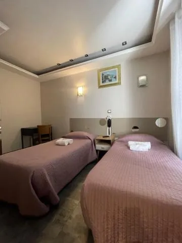 Bed in Hôtel de l'Aveyron