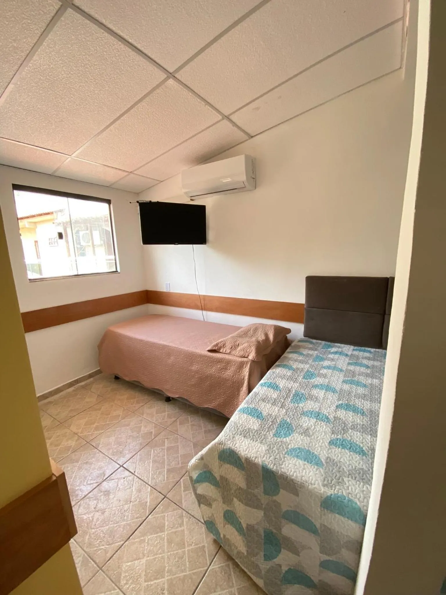 Bed in Pousada Queiroz