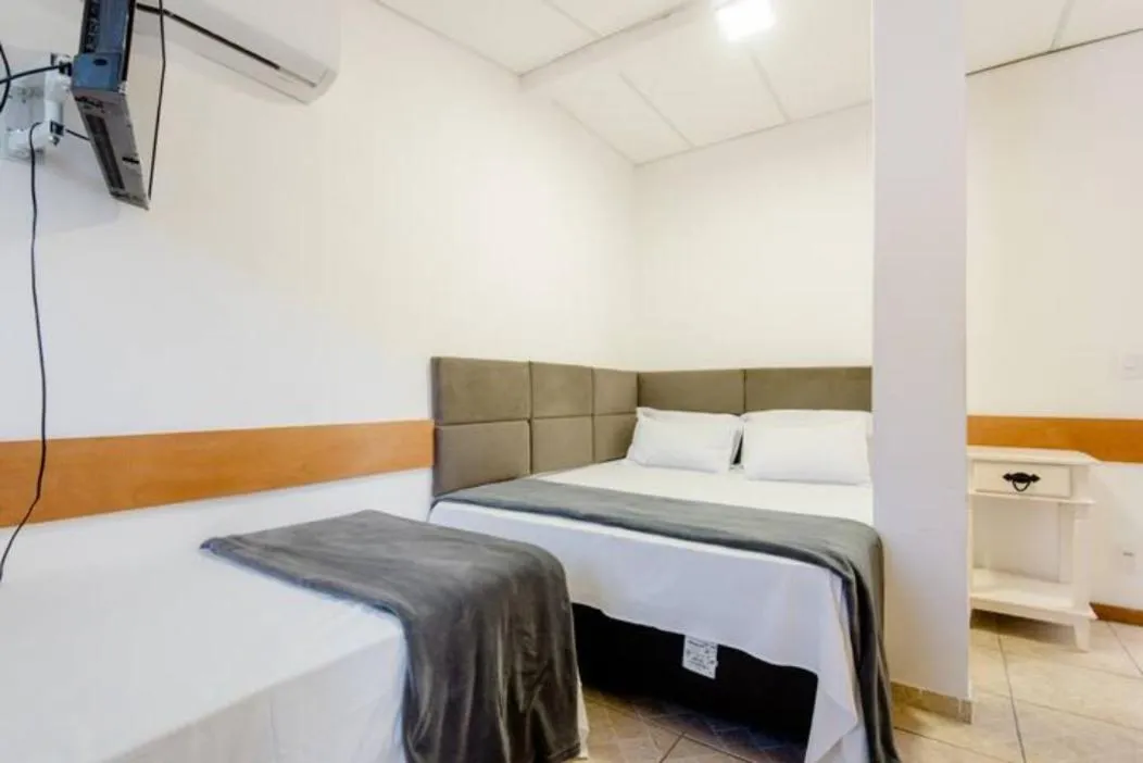 Bed in Pousada Queiroz