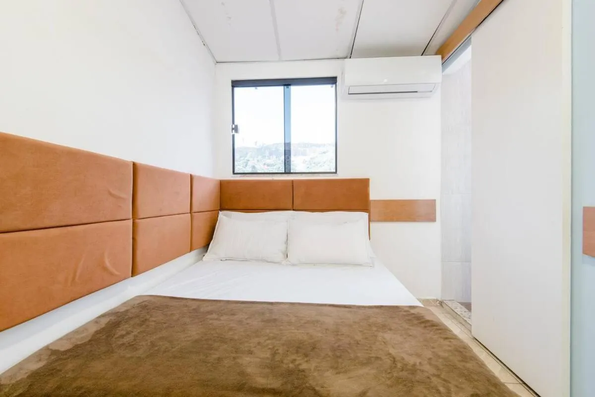 Bed in Pousada Queiroz