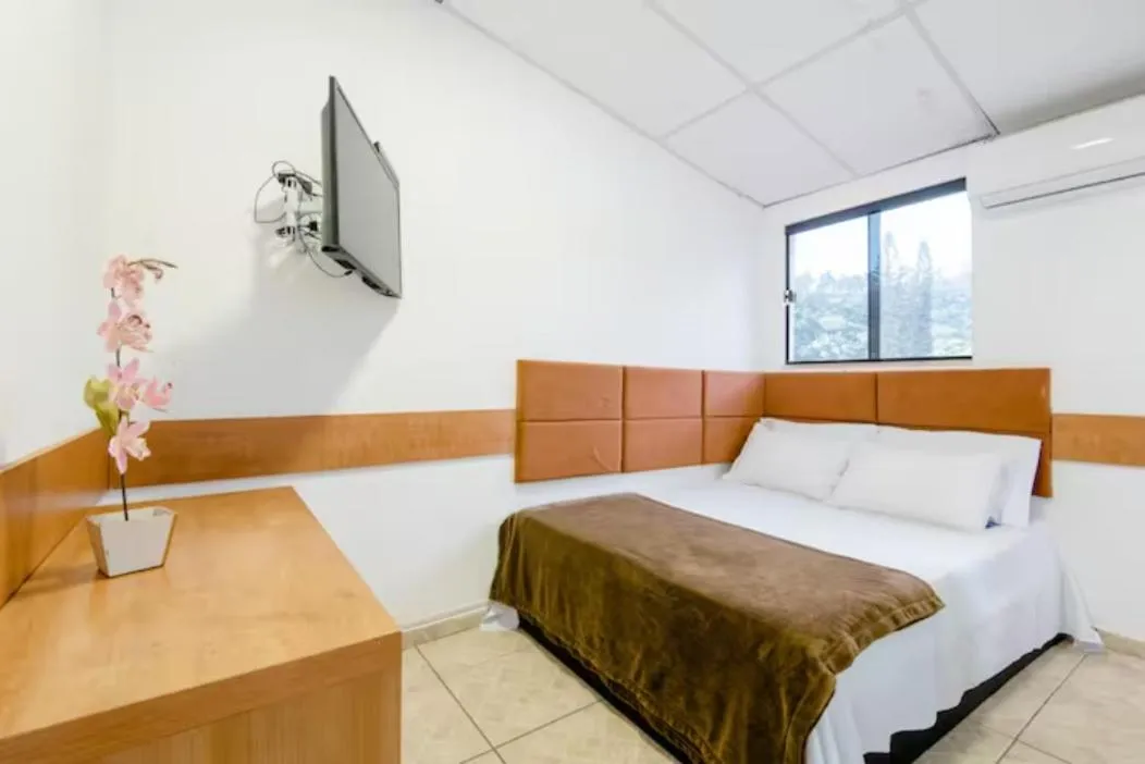 Bed in Pousada Queiroz