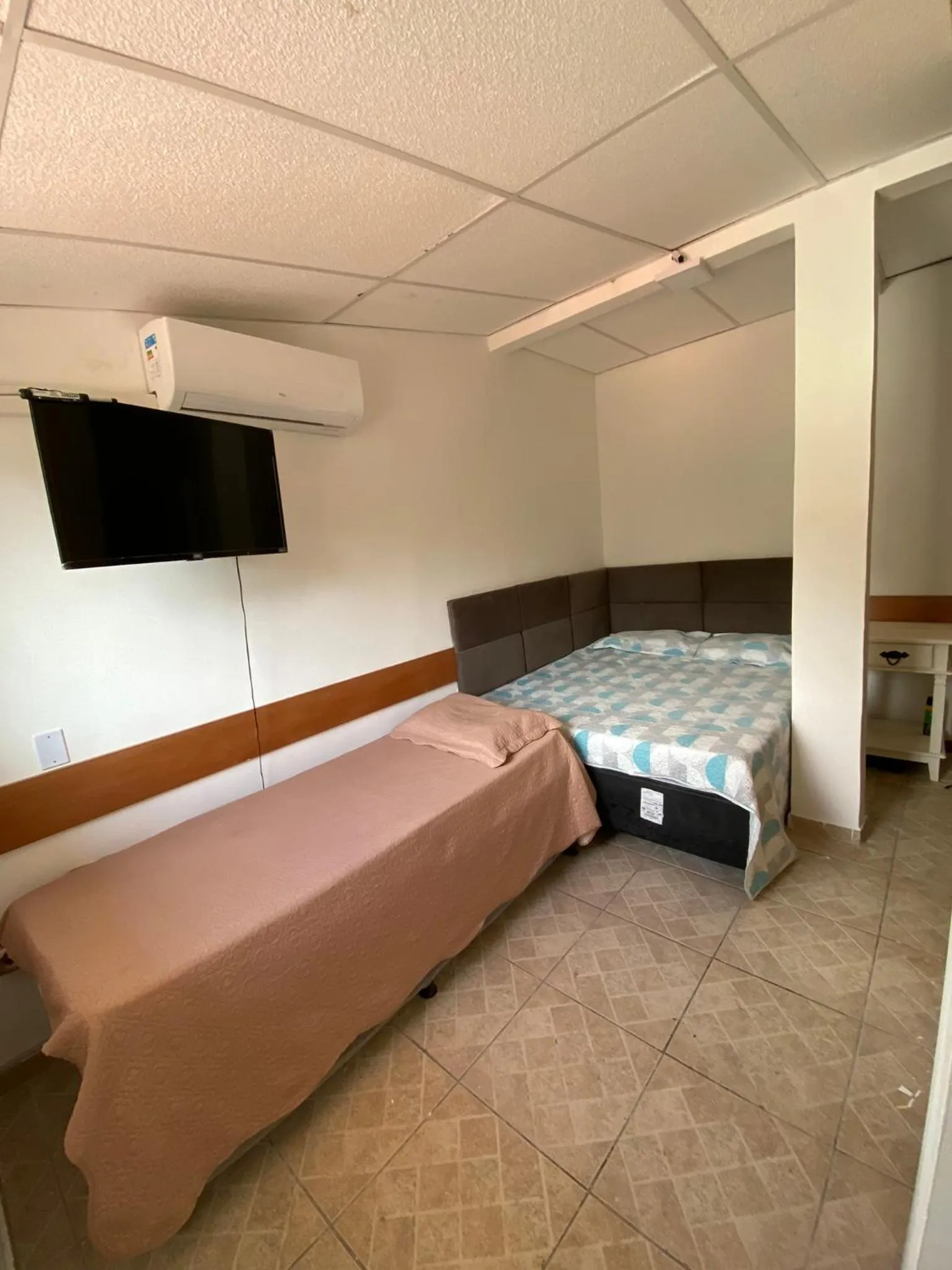 Bed in Pousada Queiroz