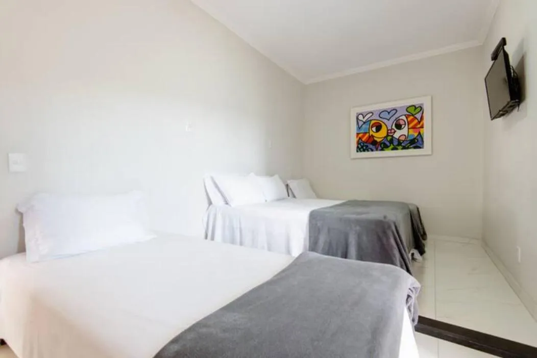 Bed in Pousada Queiroz