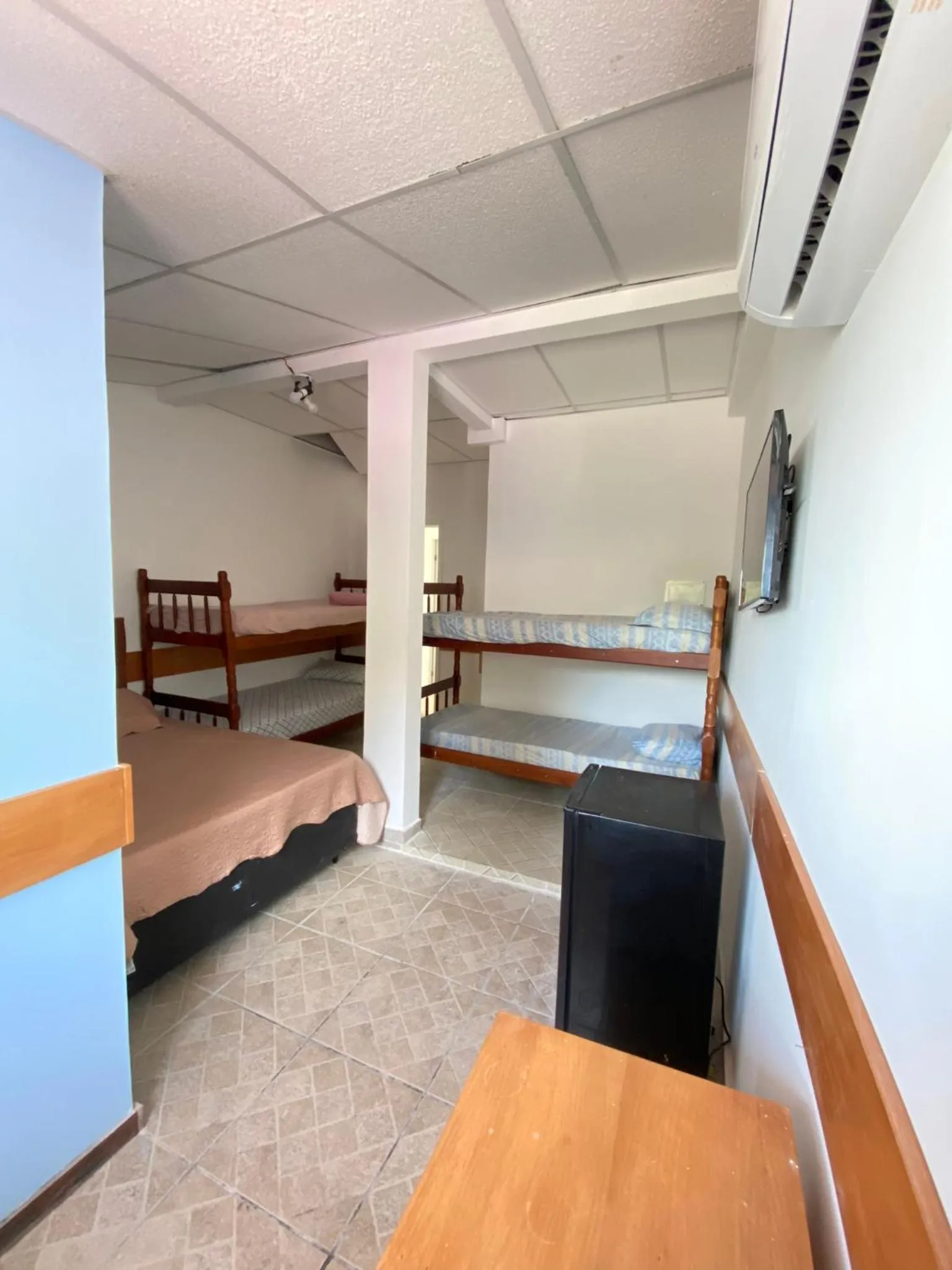 Bed in Pousada Queiroz