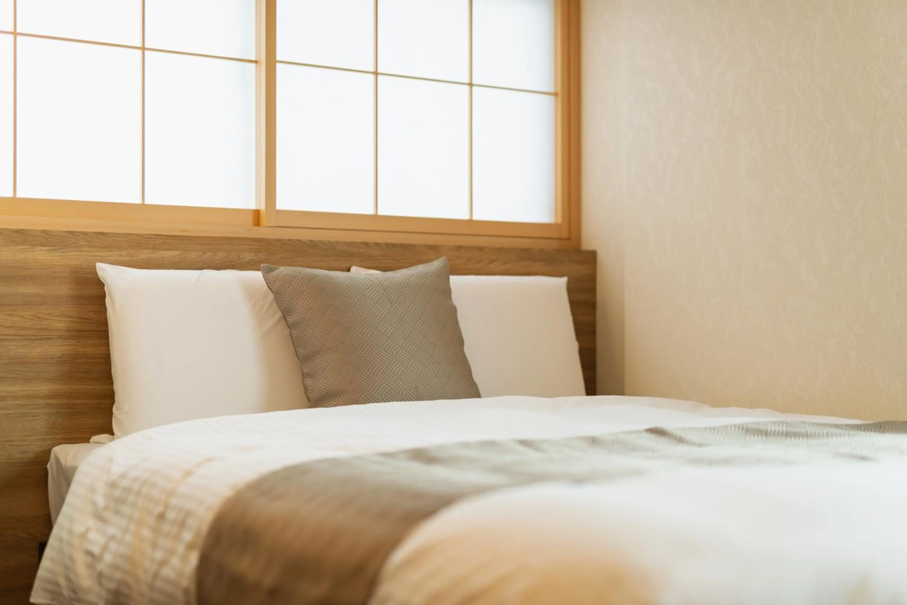 Bed in GRAND BASE Beppu