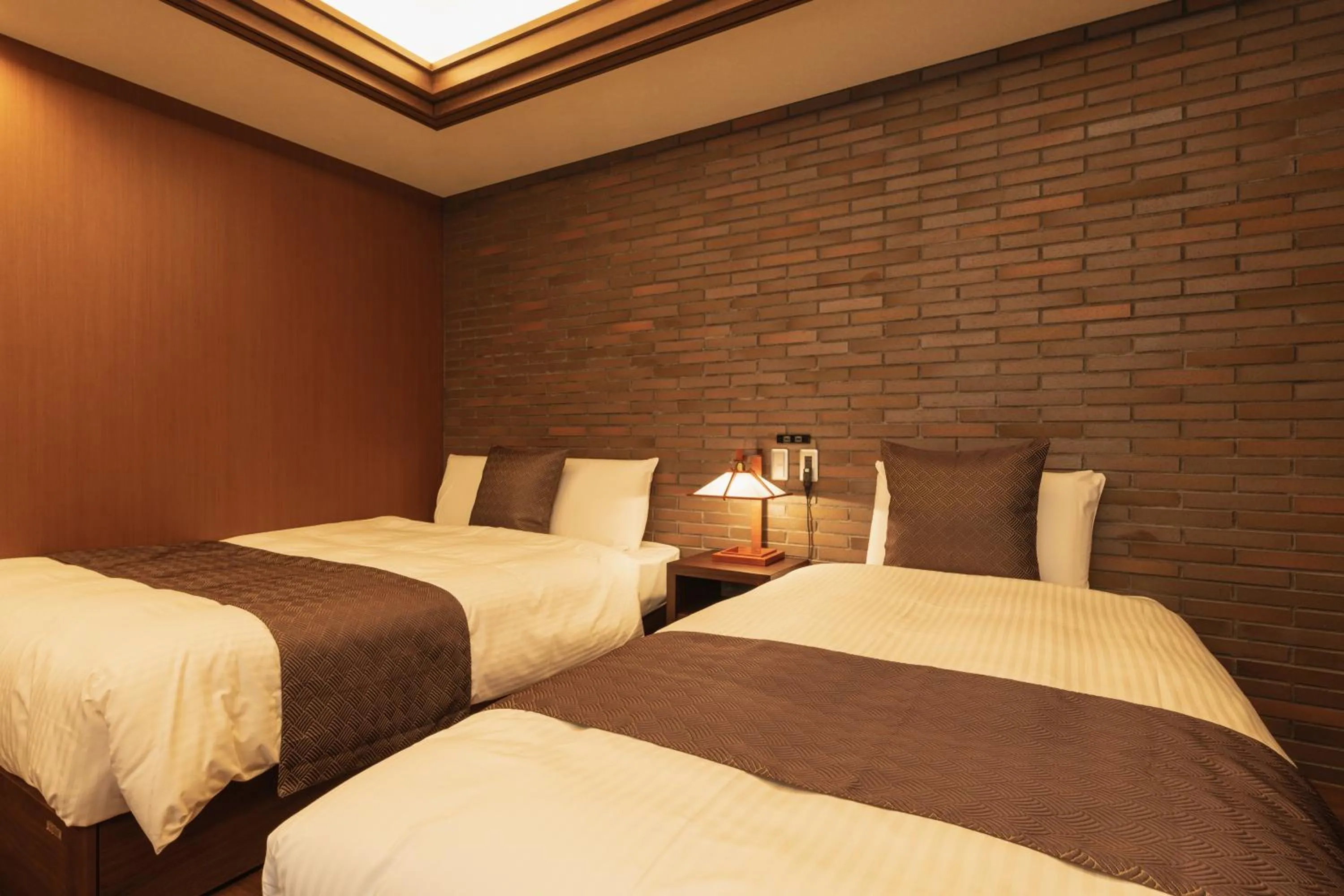 Bed in GRAND BASE Beppu