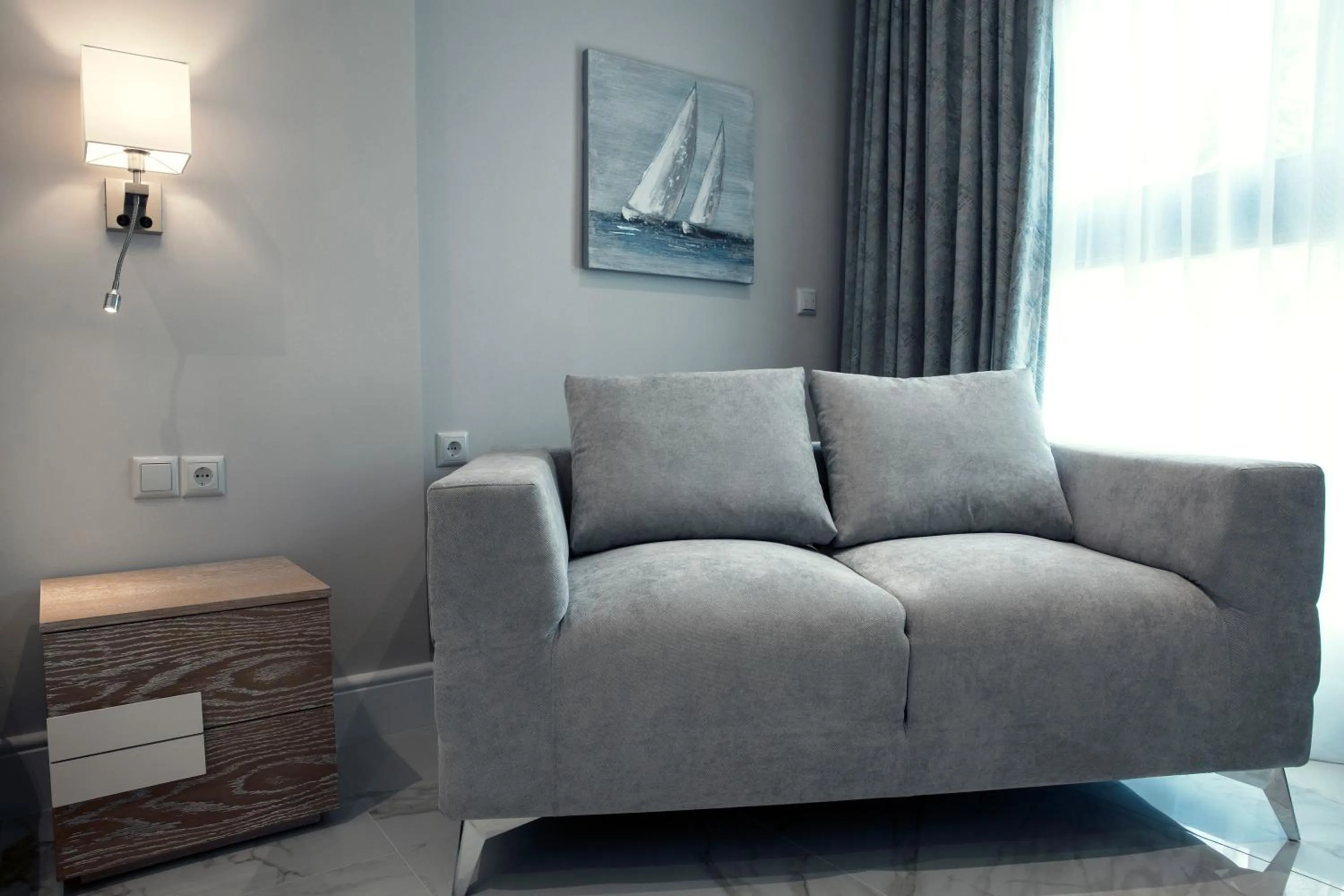 Communal lounge/ TV room in La Mer Apartments