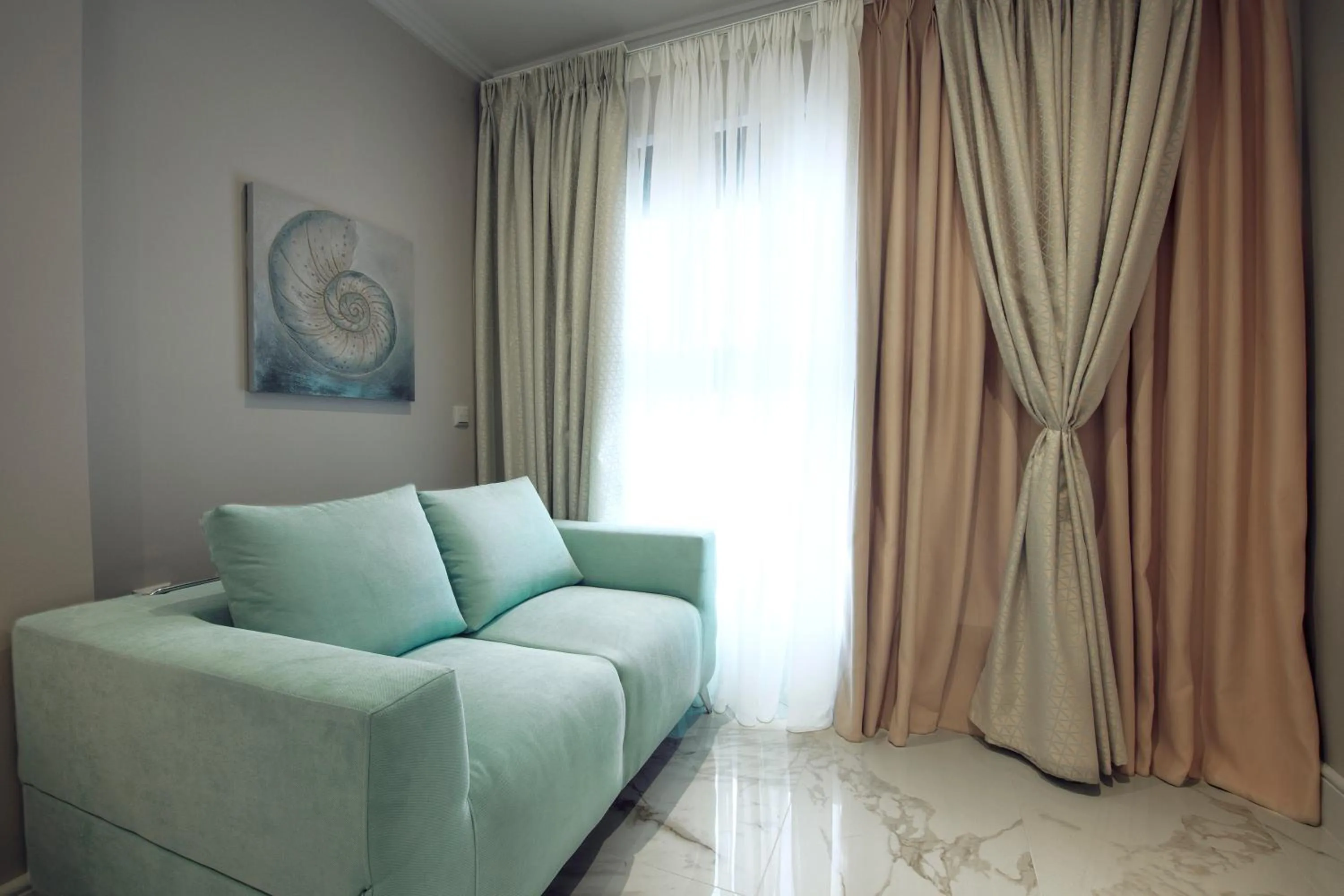 Communal lounge/ TV room in La Mer Apartments