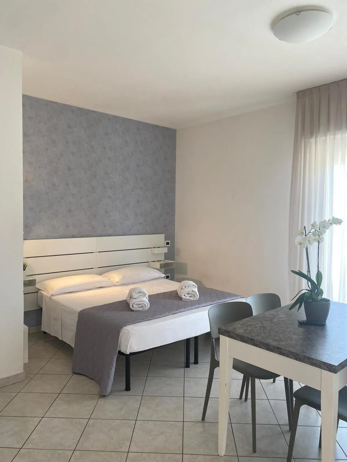 Living room, Bed in Rimini Bay Suites&Residence