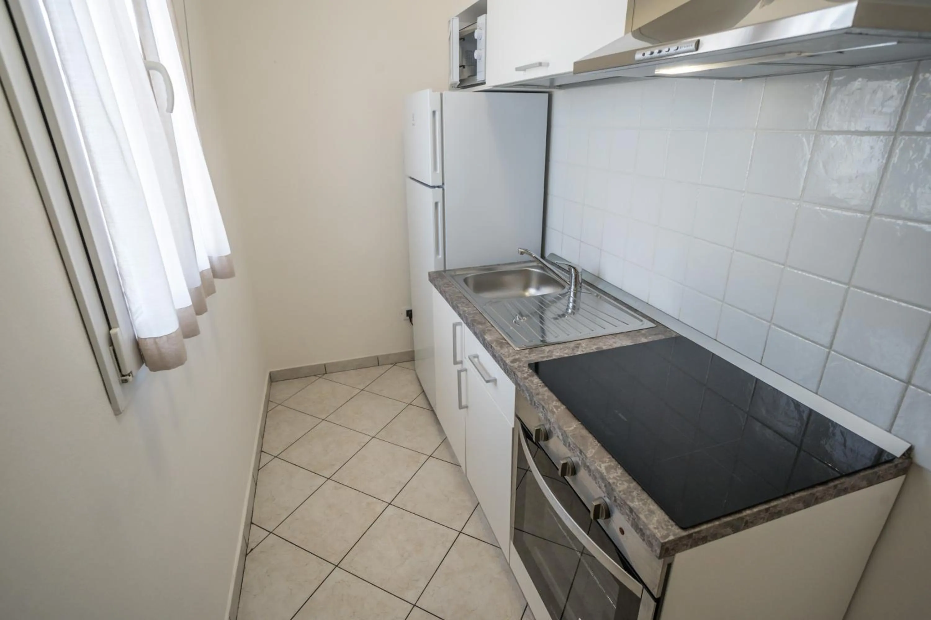 kitchen in Rimini Bay Suites&Residence