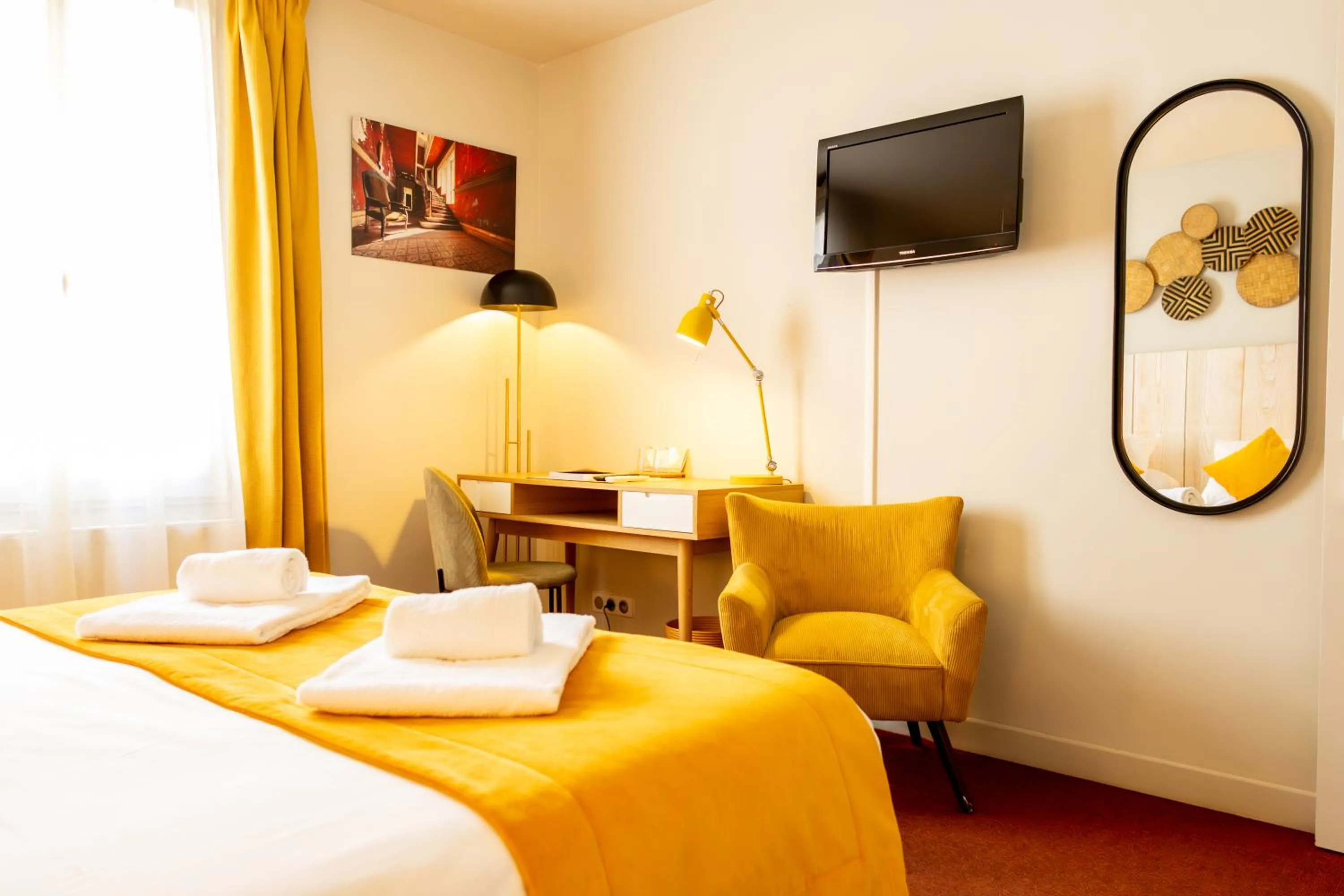 Bed in Le Central Boutique Hôtel