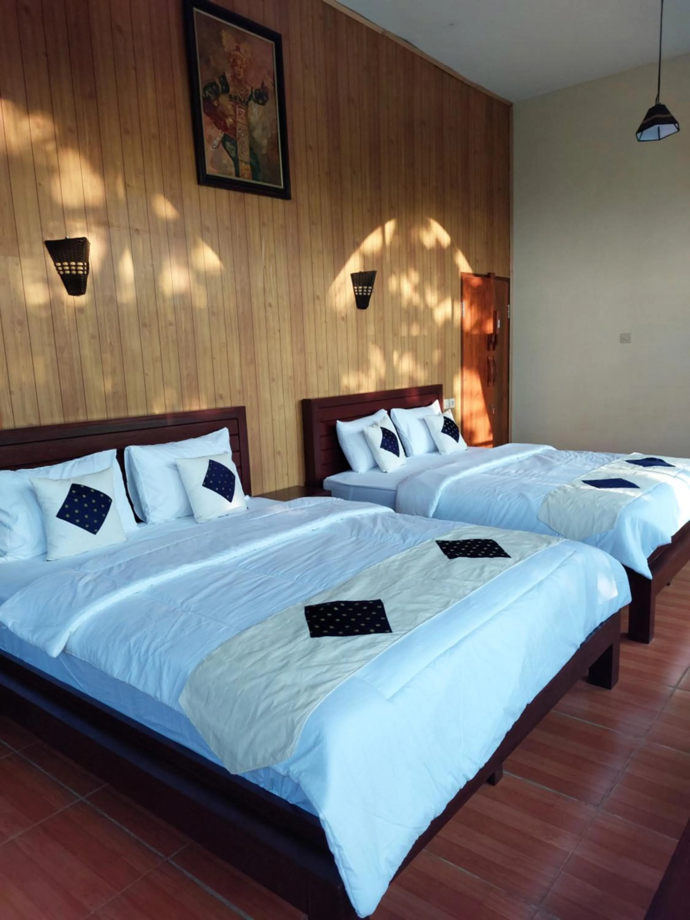 Bed in Bliss family cottage Batu