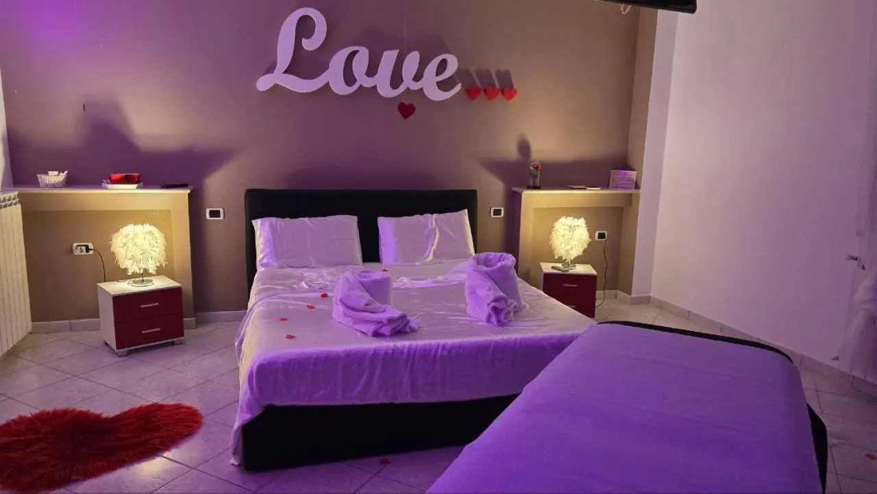 Bed in Andale SuiteSpa