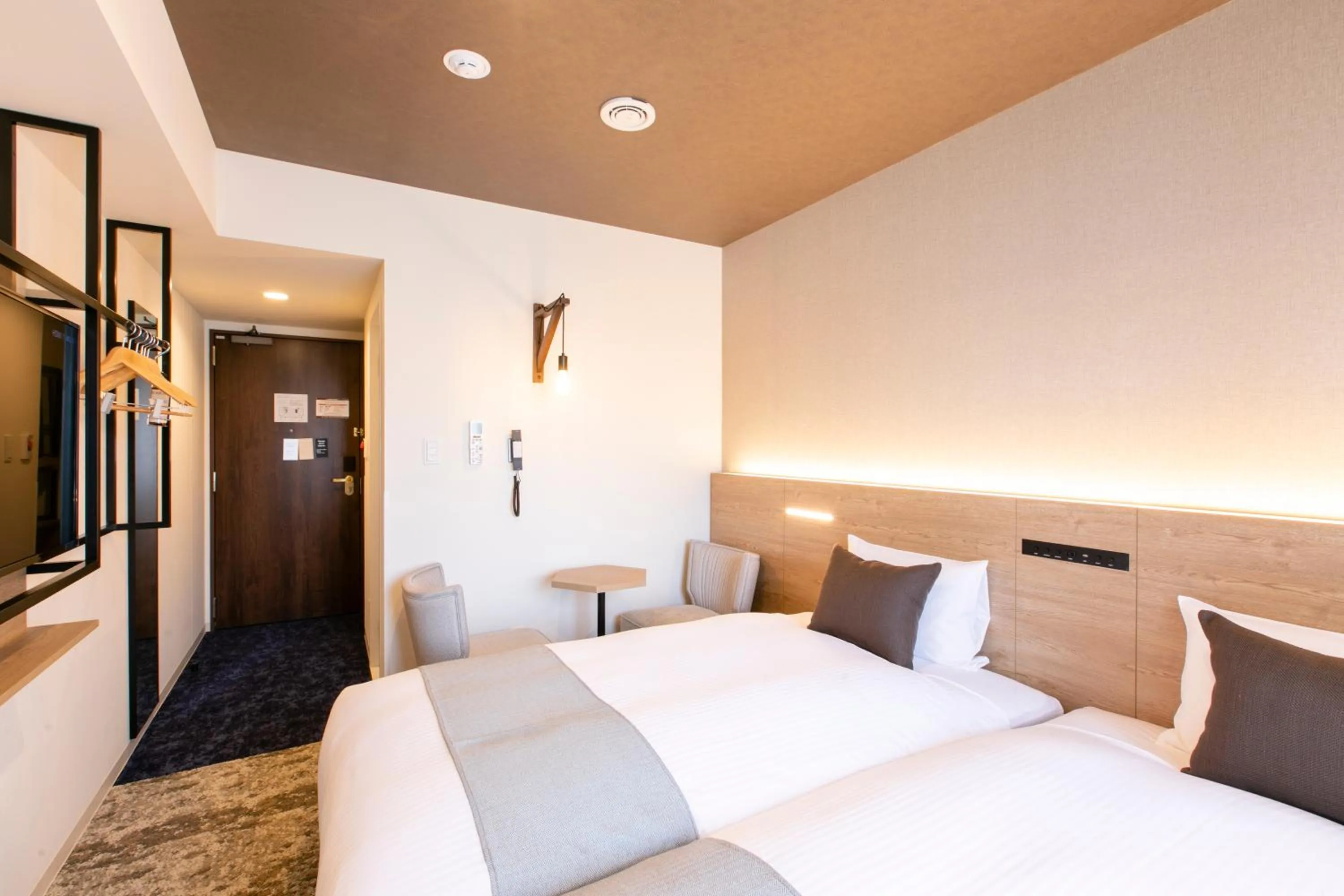 Photo of the whole room, Bed in KOKO HOTEL Sapporo Susukino - formerly Hotel Wing International Sapporo Susukino