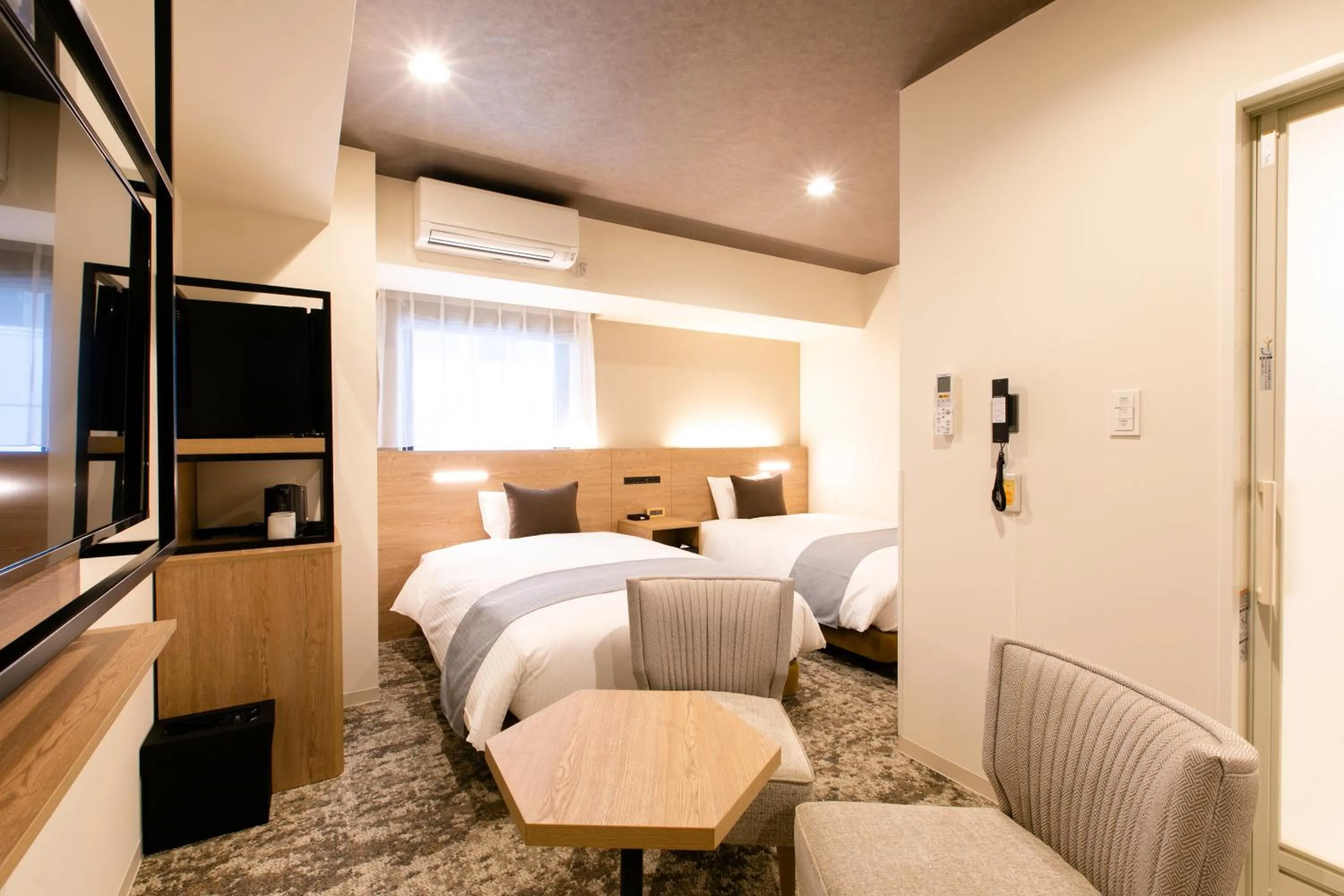 Photo of the whole room, Bed in KOKO HOTEL Sapporo Susukino - formerly Hotel Wing International Sapporo Susukino