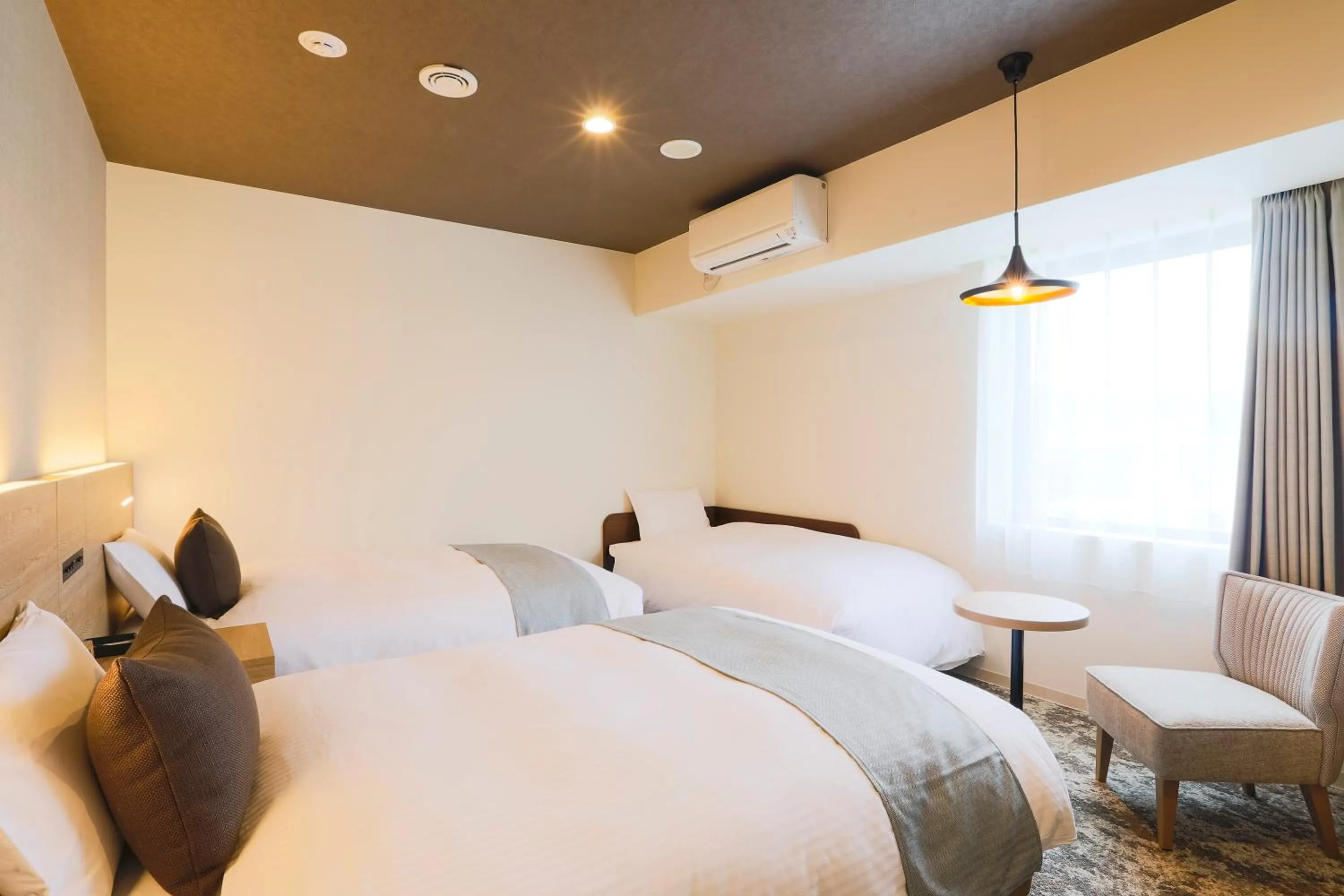 Photo of the whole room, Bed in KOKO HOTEL Sapporo Susukino - formerly Hotel Wing International Sapporo Susukino