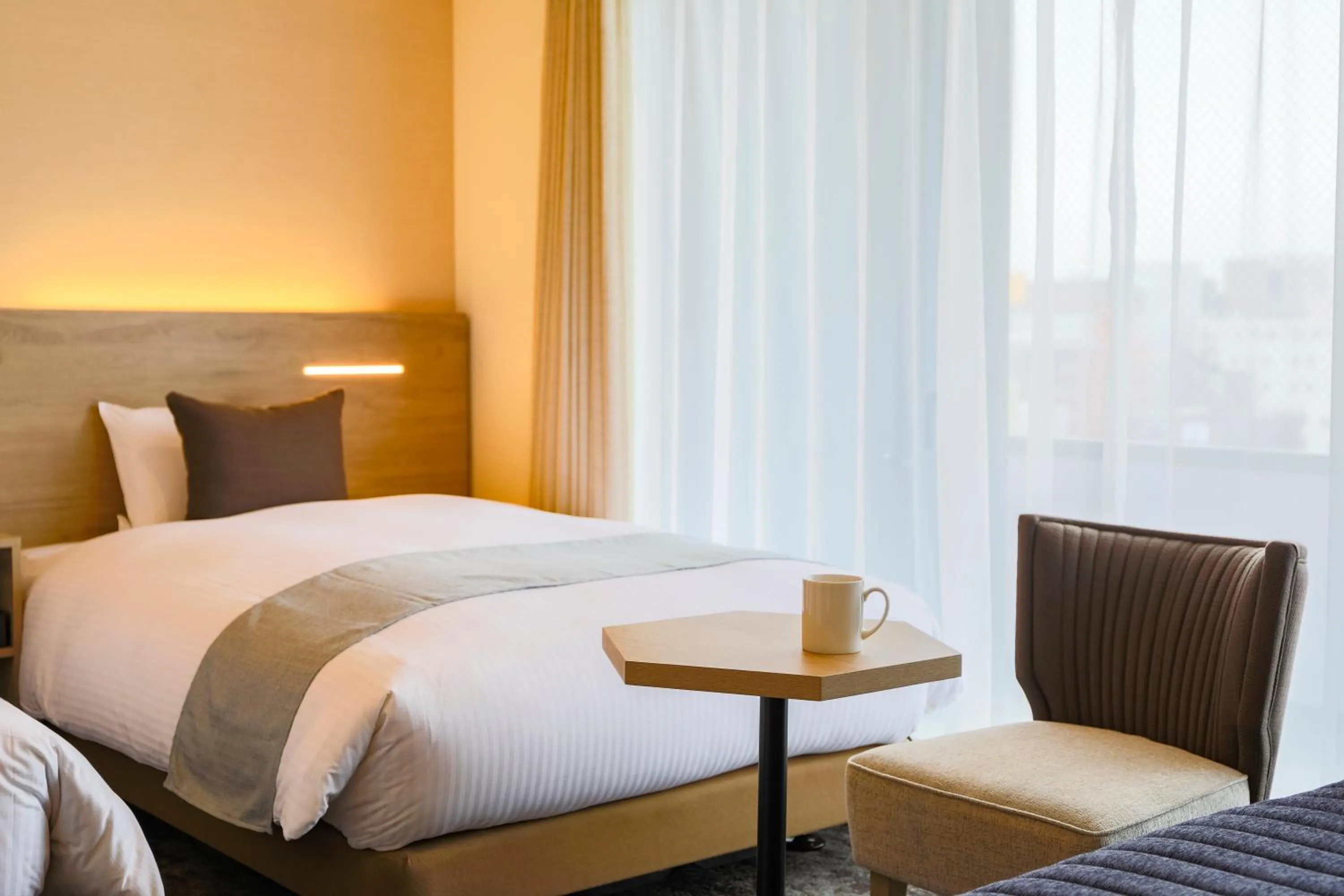 Photo of the whole room, Bed in KOKO HOTEL Sapporo Susukino - formerly Hotel Wing International Sapporo Susukino