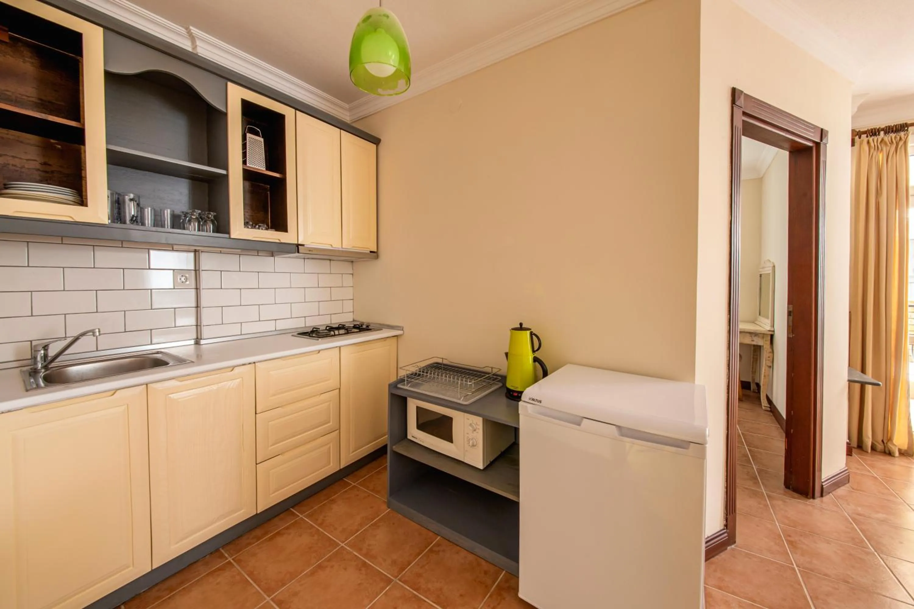 Kitchen or kitchenette in Lantana Aparts