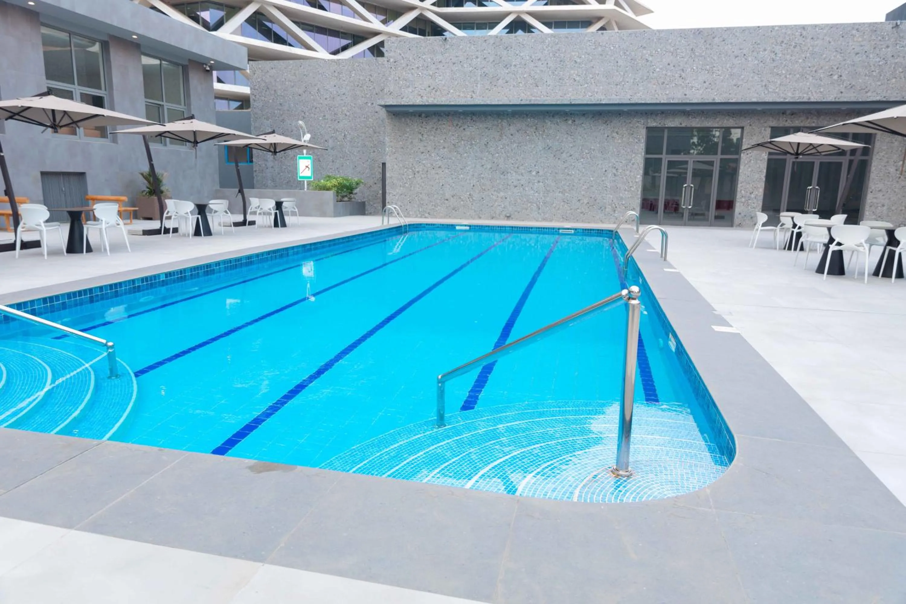 Swimming pool in The Palms by Eagles Airport City