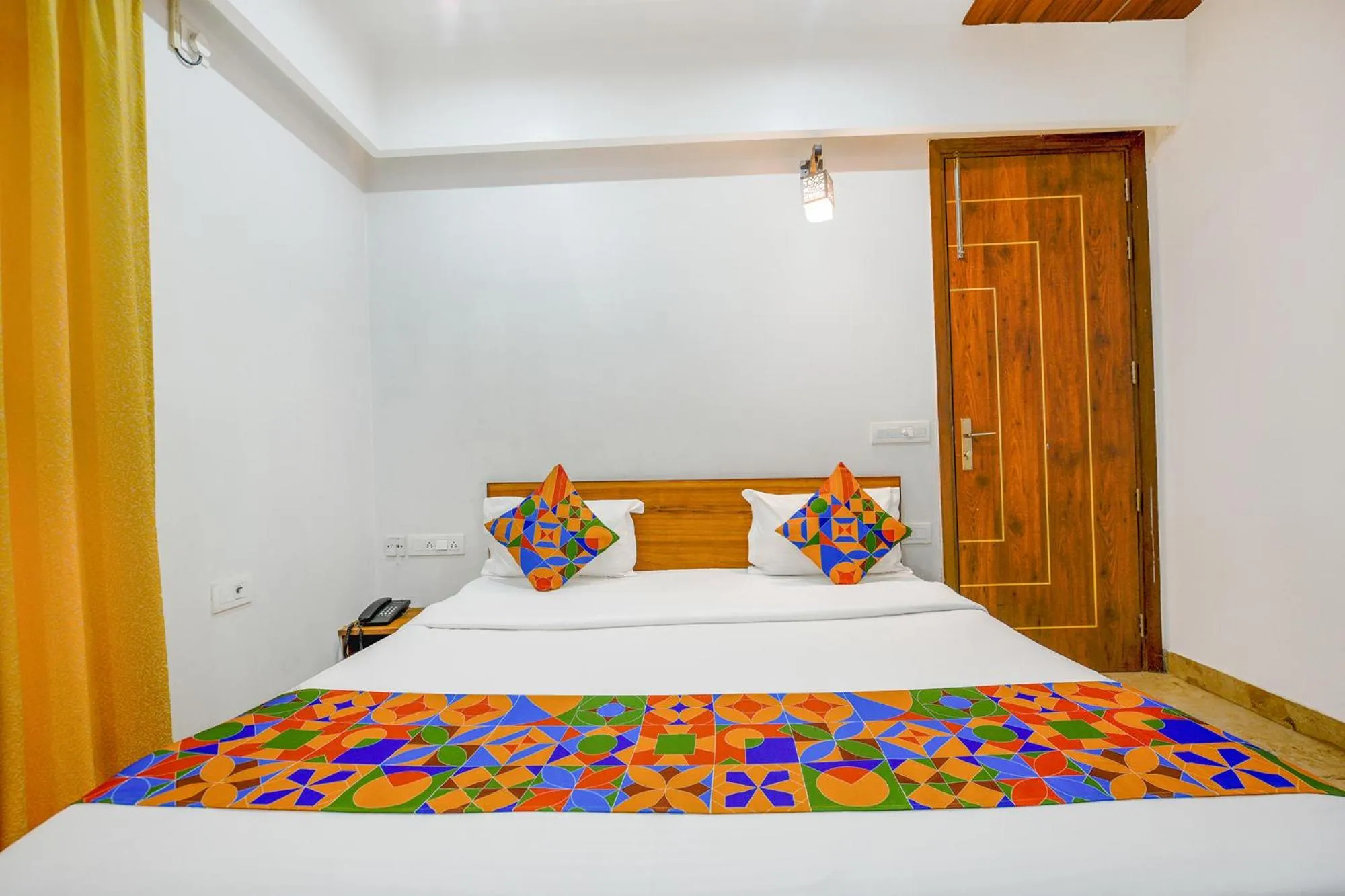 Bed in FabHotel Amrit Residency