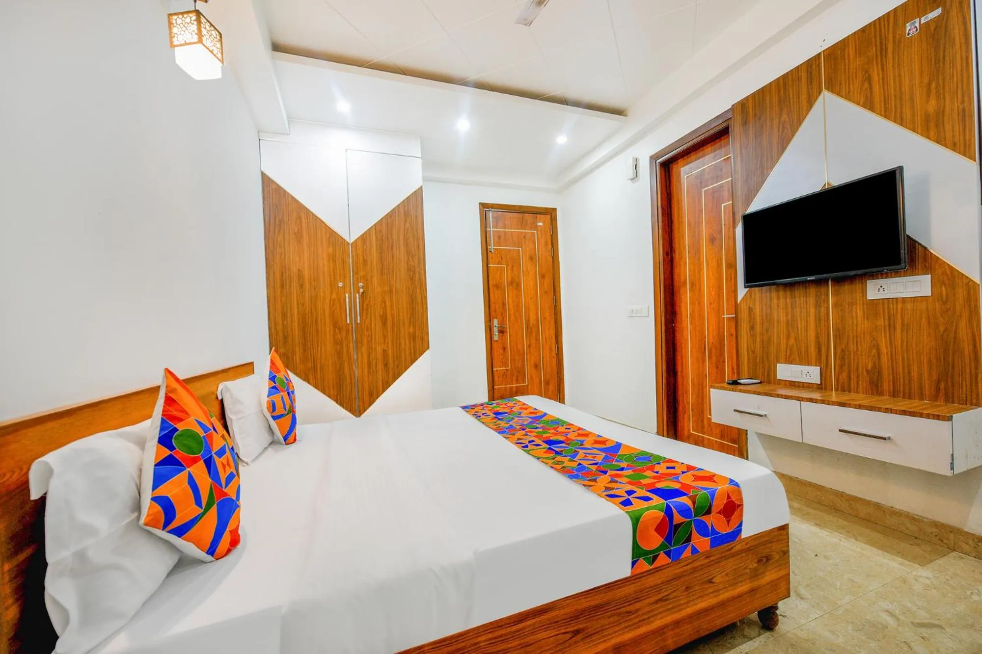 Bed in FabHotel Amrit Residency